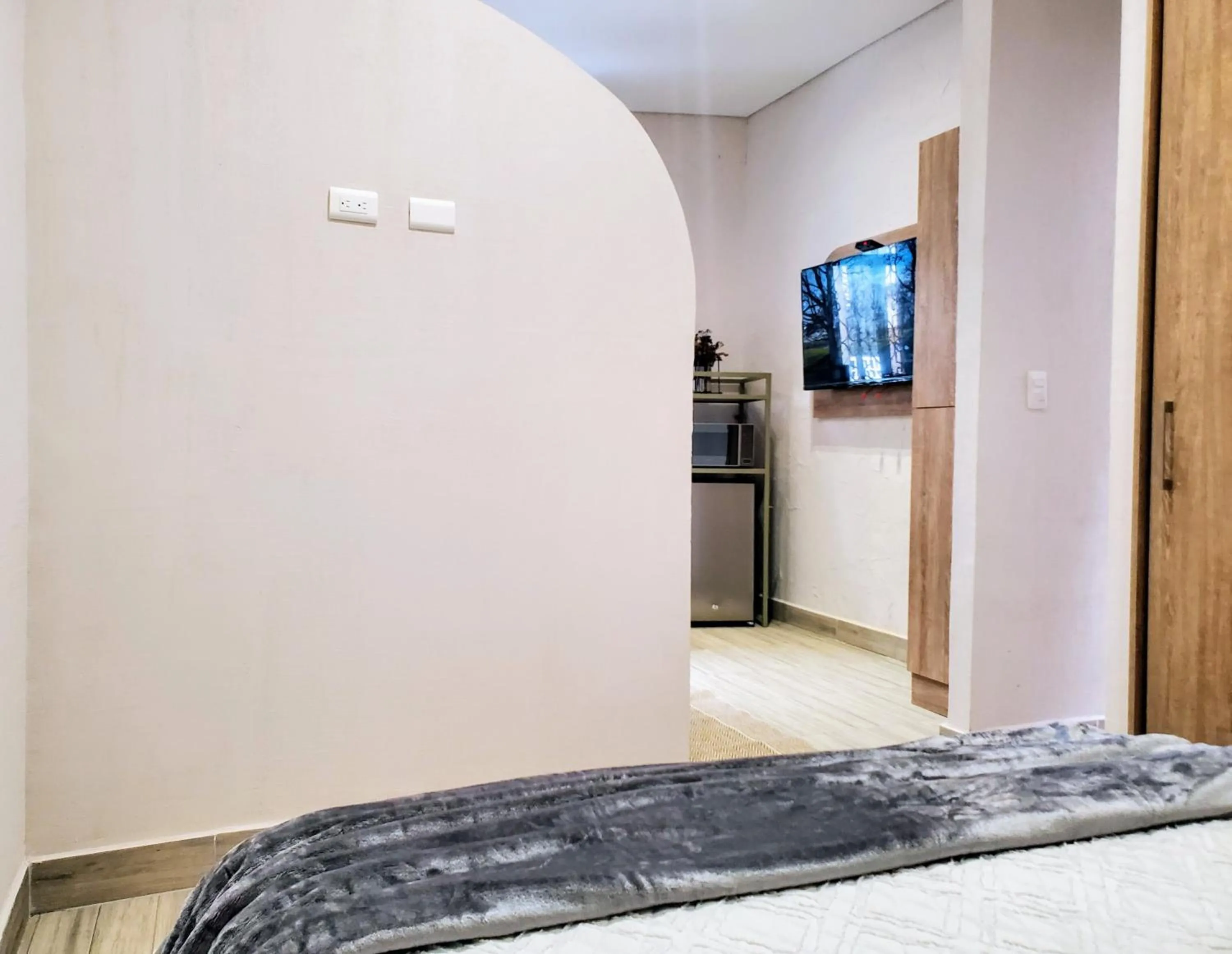 Photo of the whole room, Bed in Zentrico Boutique