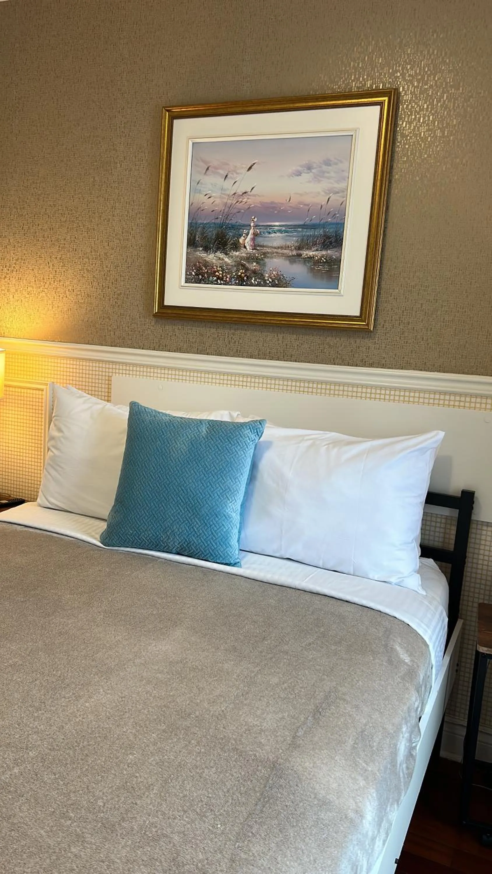 Bed in Parc Suites Hotel