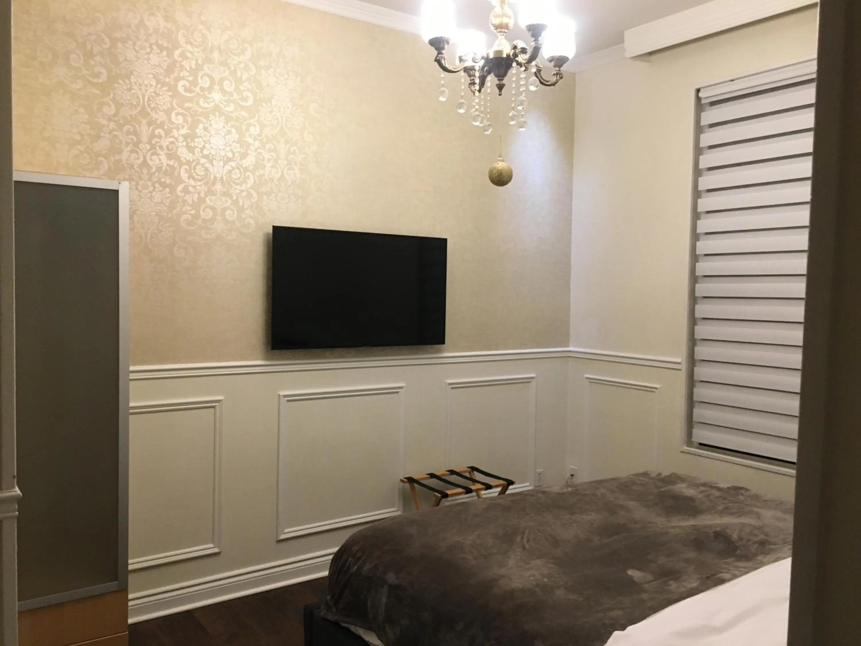 Bed in Parc Suites Hotel