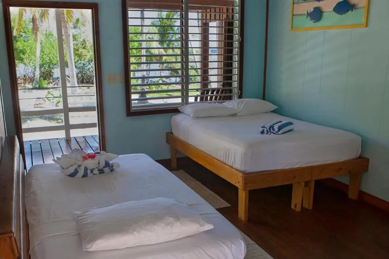 Bedroom, Bed in Pelican Beach Resort South Water Caye