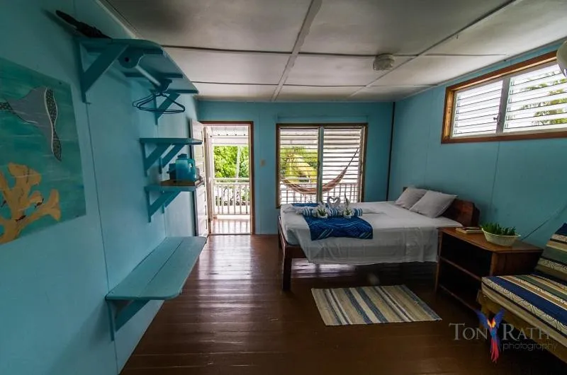 Bedroom, Bed in Pelican Beach Resort South Water Caye