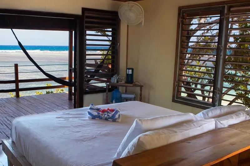 Balcony/Terrace, Bed in Pelican Beach Resort South Water Caye