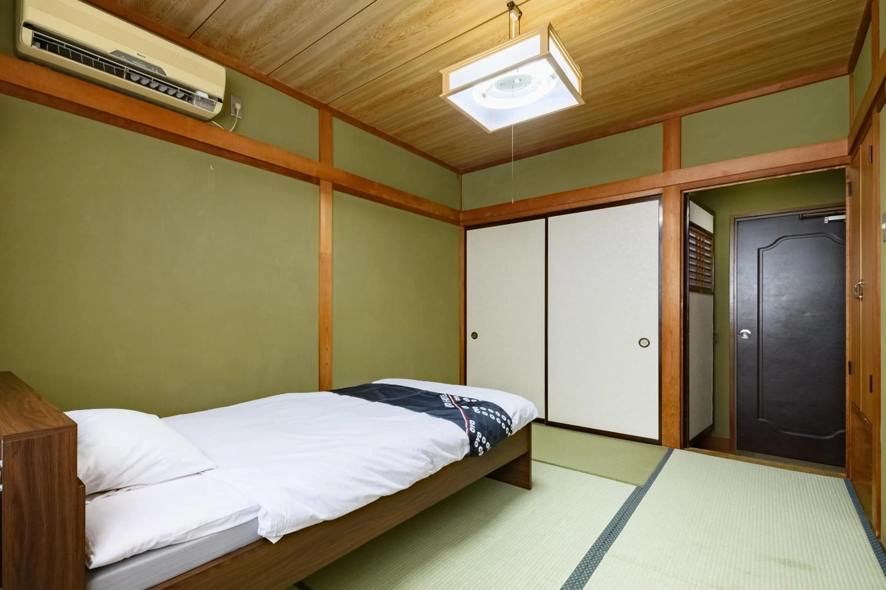 Bed in Tabist HotelNakajima Fuji