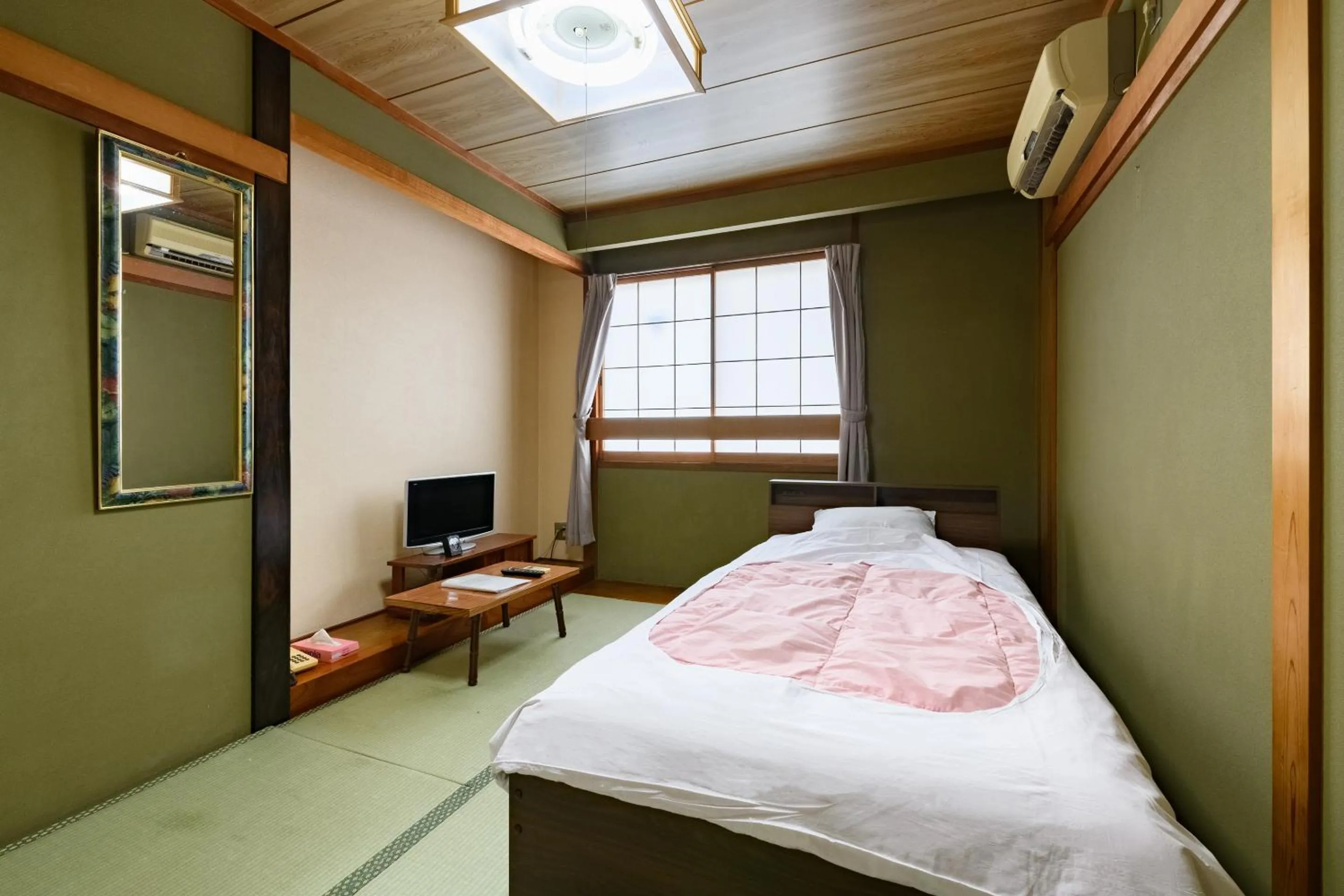 Bed in Tabist HotelNakajima Fuji