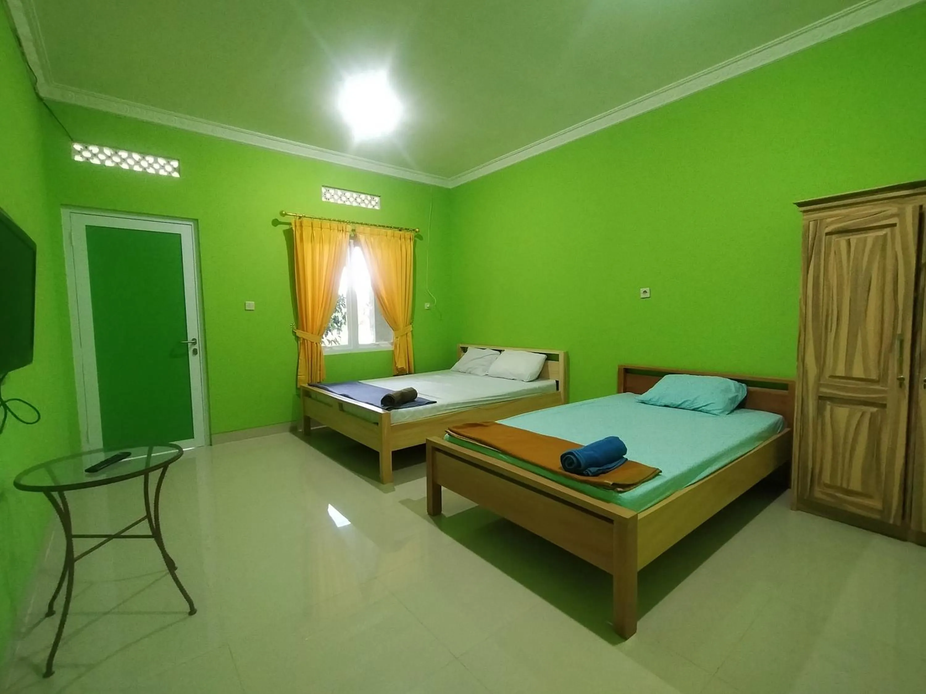 Bed in Villa Batu Tua Puncak Mitra RedDoorz