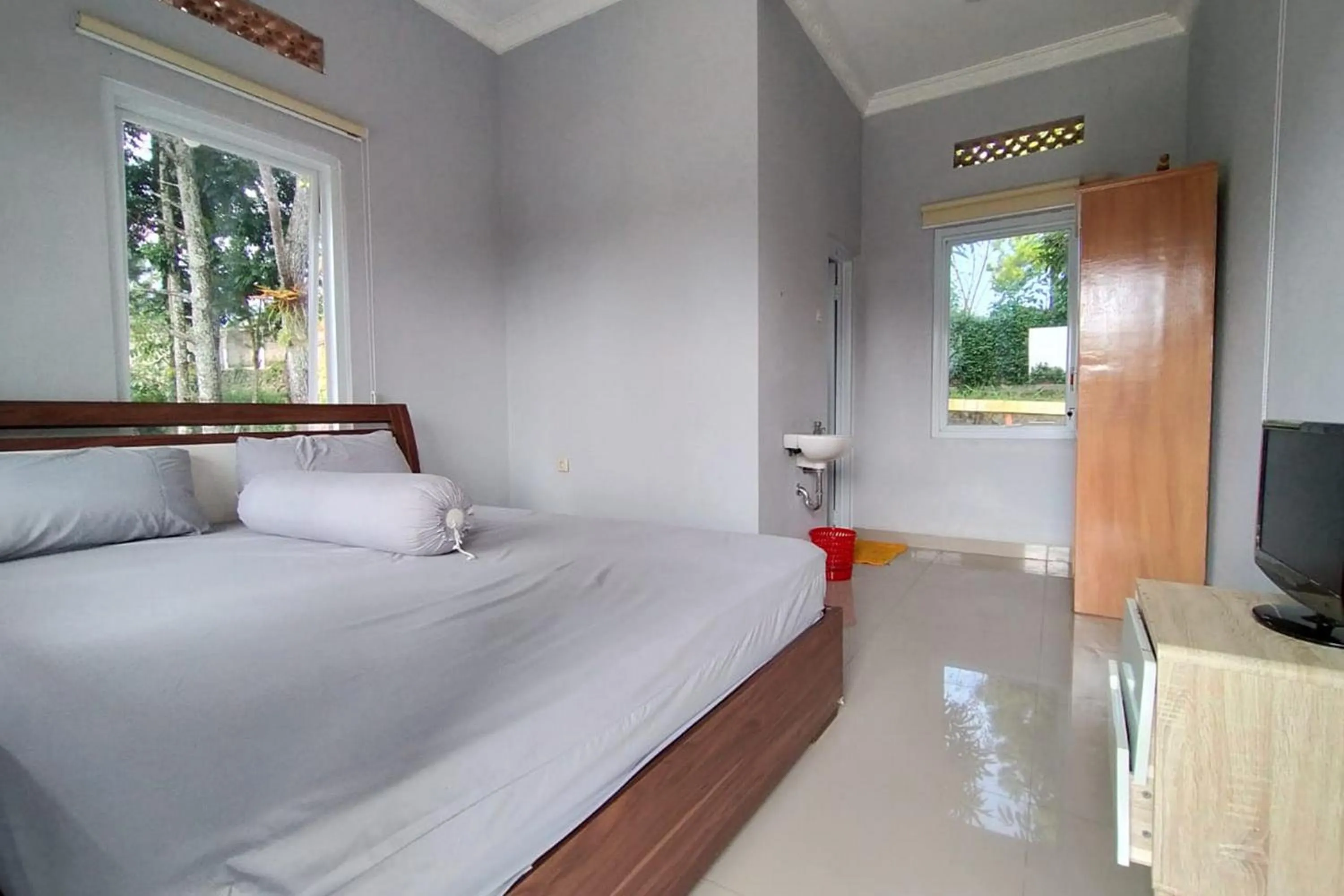 Bed in Villa Batu Tua Puncak Mitra RedDoorz