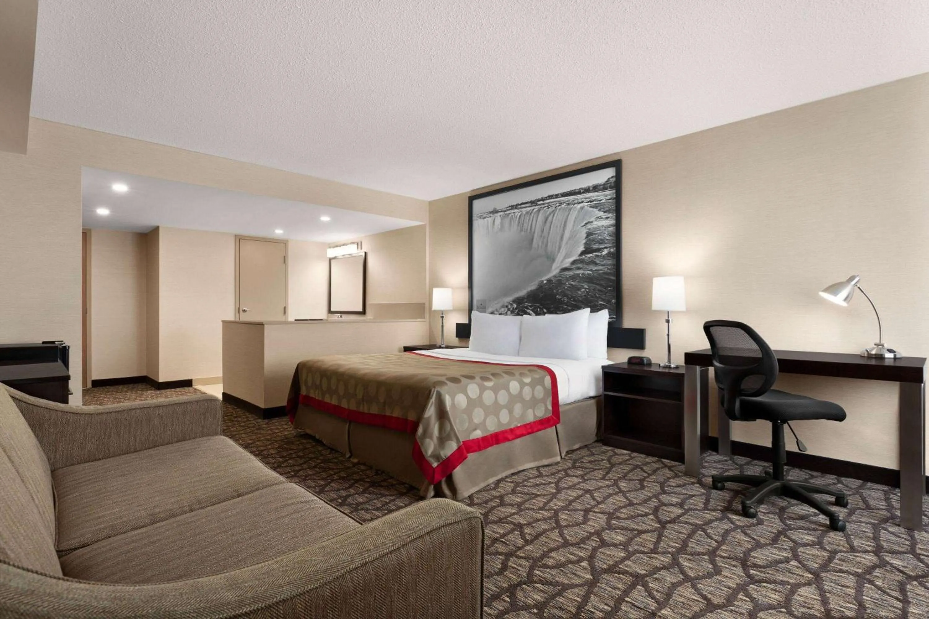 Photo of the whole room, Bed in Ramada By Wyndham Niagara Falls near the Falls