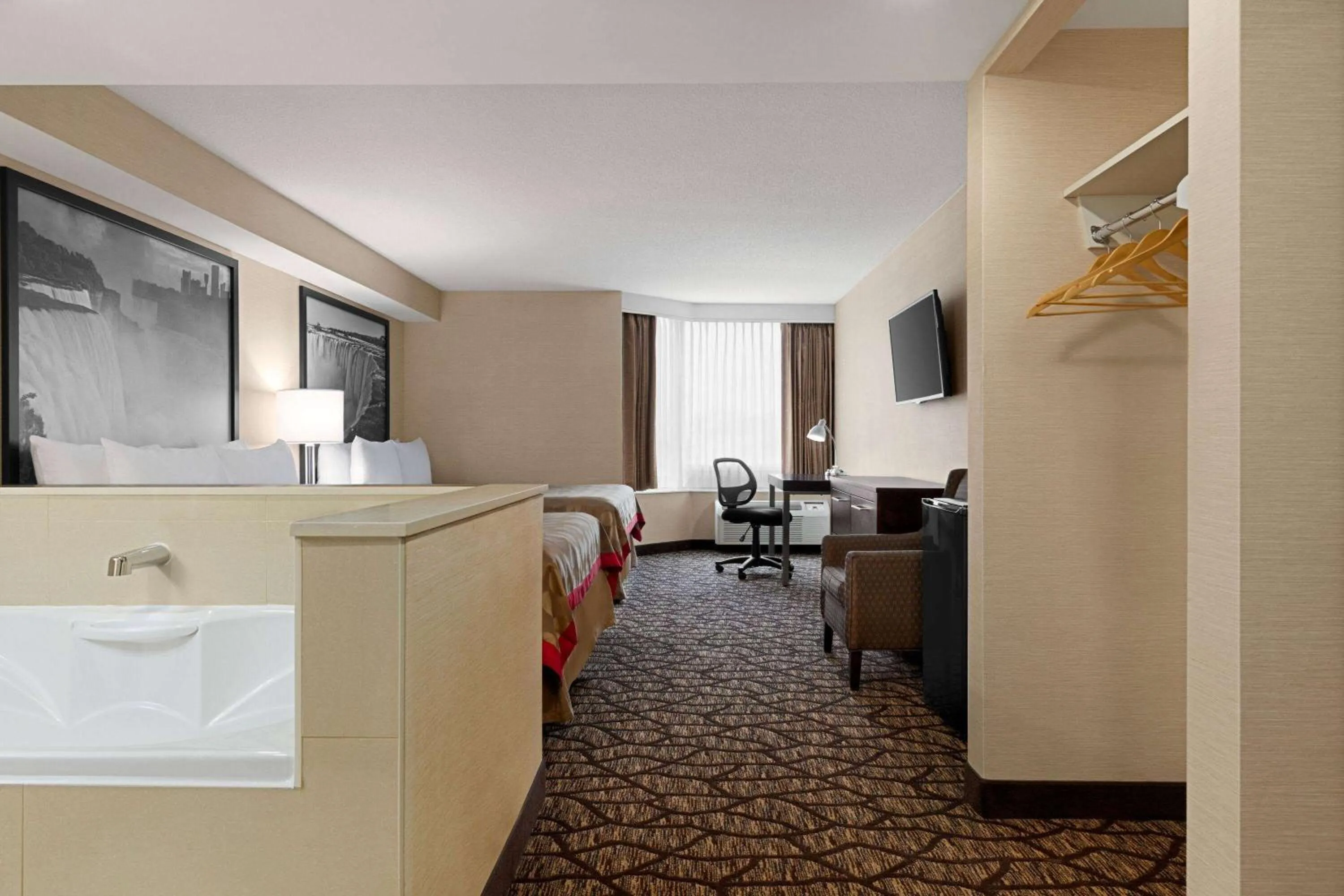 Photo of the whole room in Ramada By Wyndham Niagara Falls near the Falls