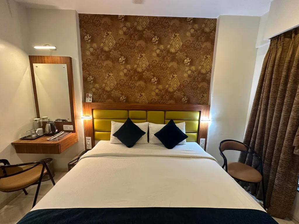 Bed in SriKrishna Paradise Hotel Thane Navi Mumbai