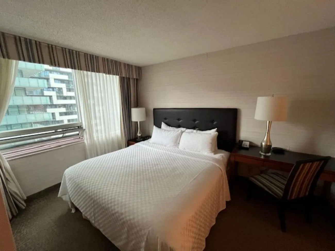Bed in Cambridge Suites Toronto