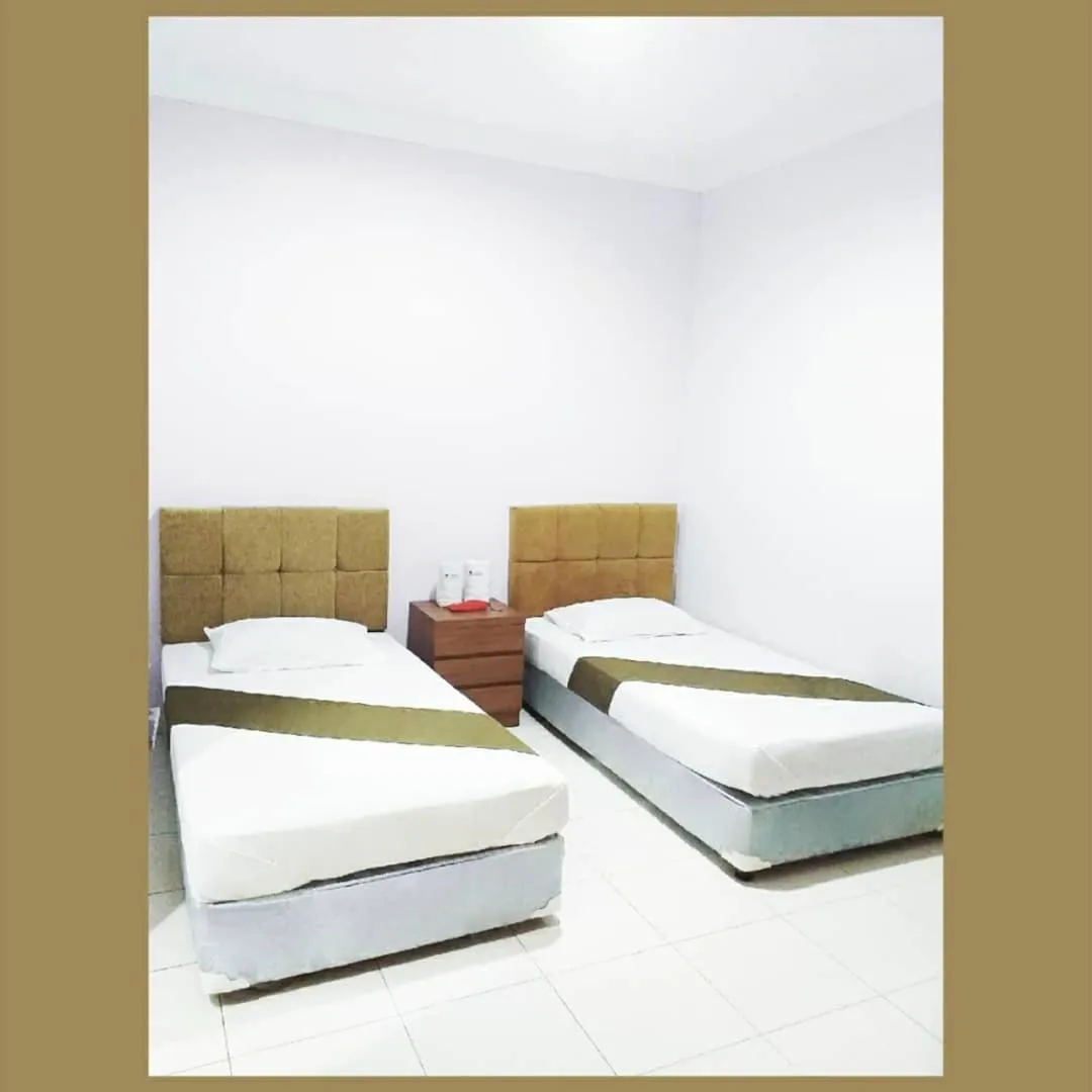 Bed in BLESSING RESIDENCE HOTEL
