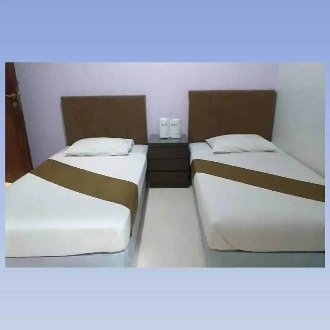 Bed in BLESSING RESIDENCE HOTEL