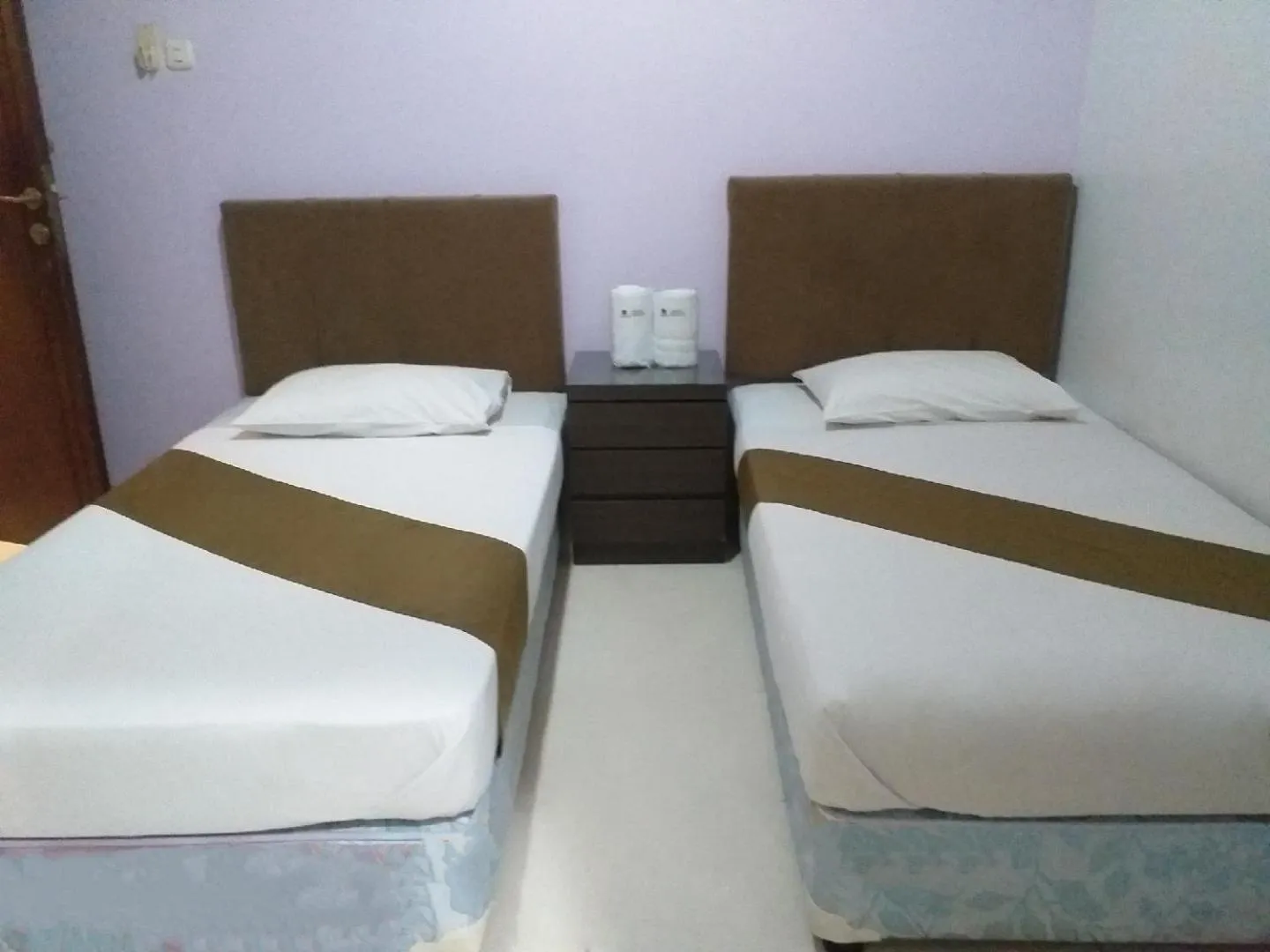 Bed in BLESSING RESIDENCE HOTEL