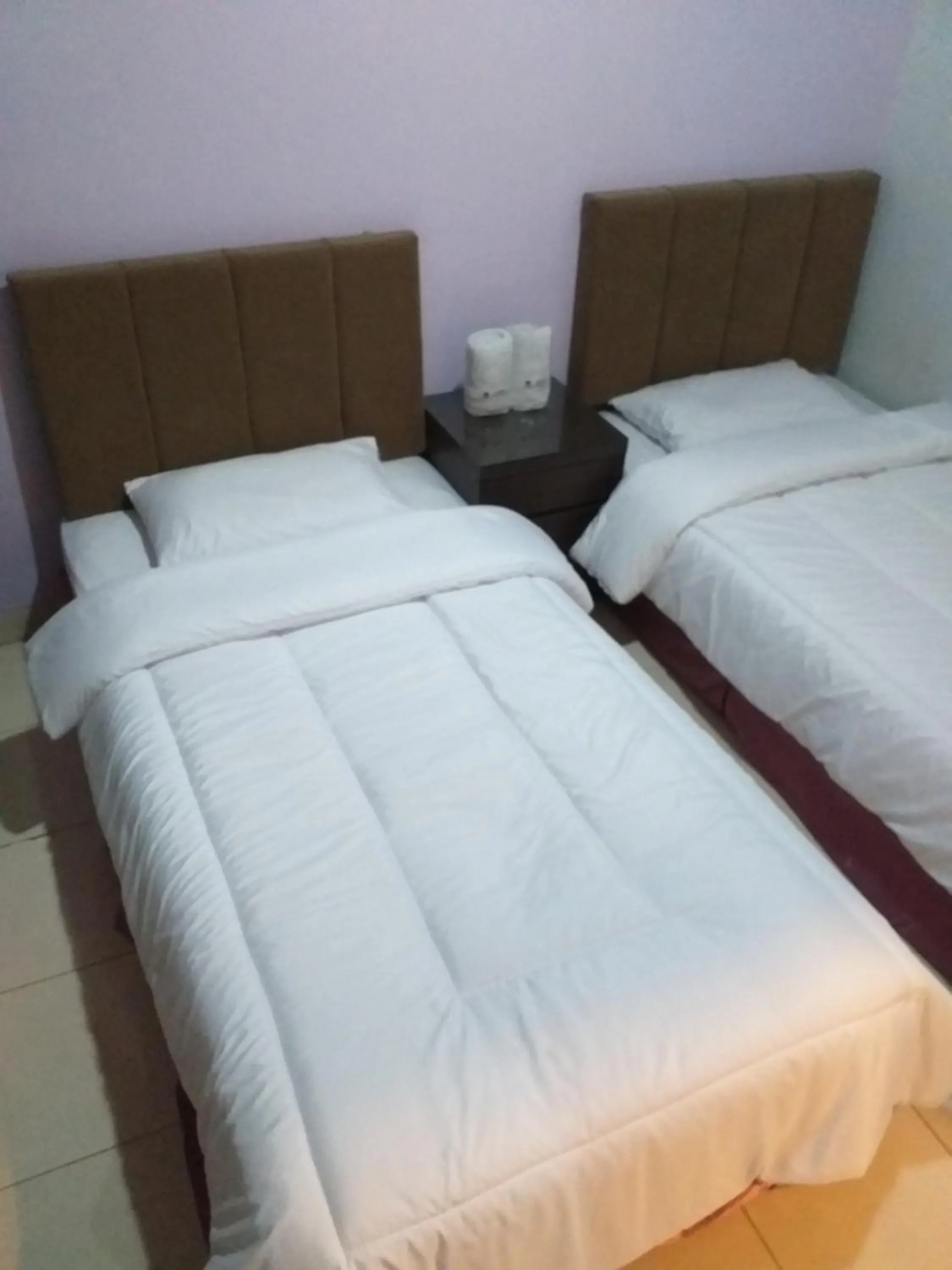 Bed in BLESSING RESIDENCE HOTEL