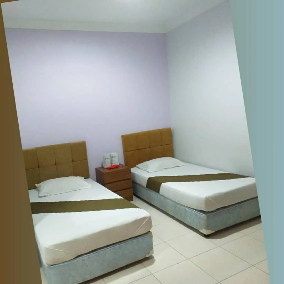 Bed in BLESSING RESIDENCE HOTEL