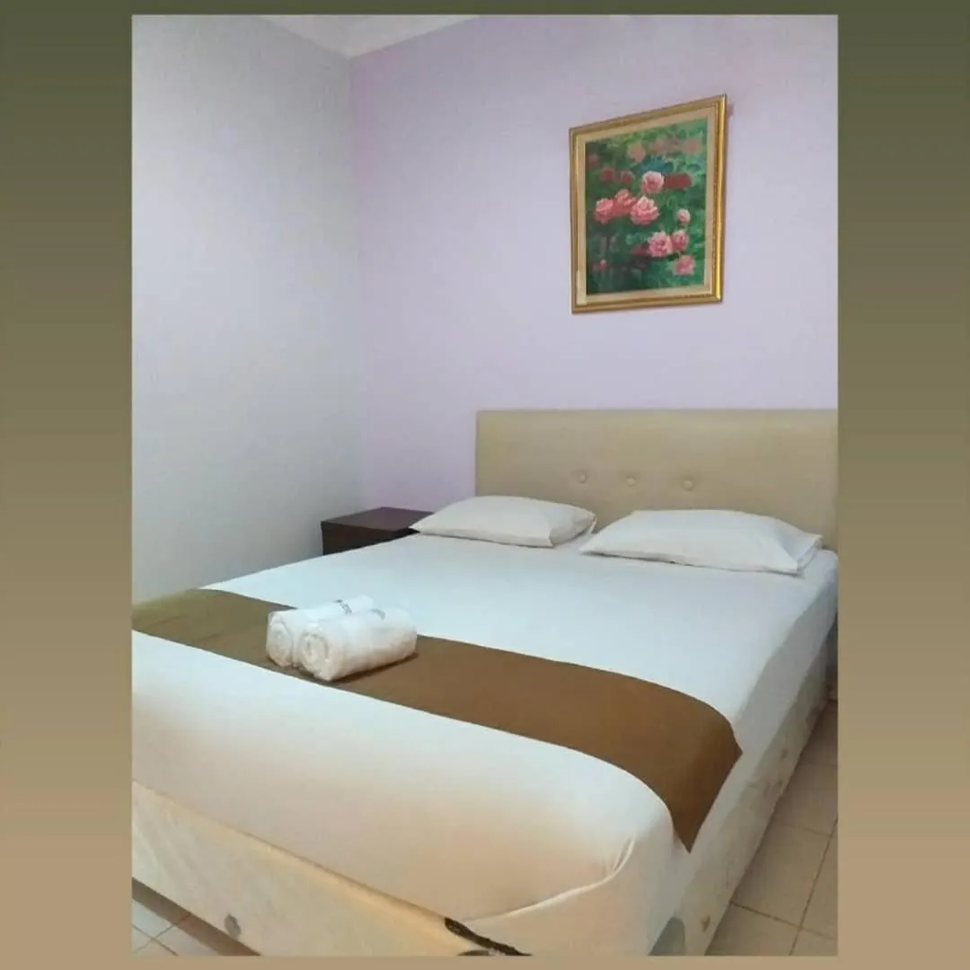 Bed in BLESSING RESIDENCE HOTEL
