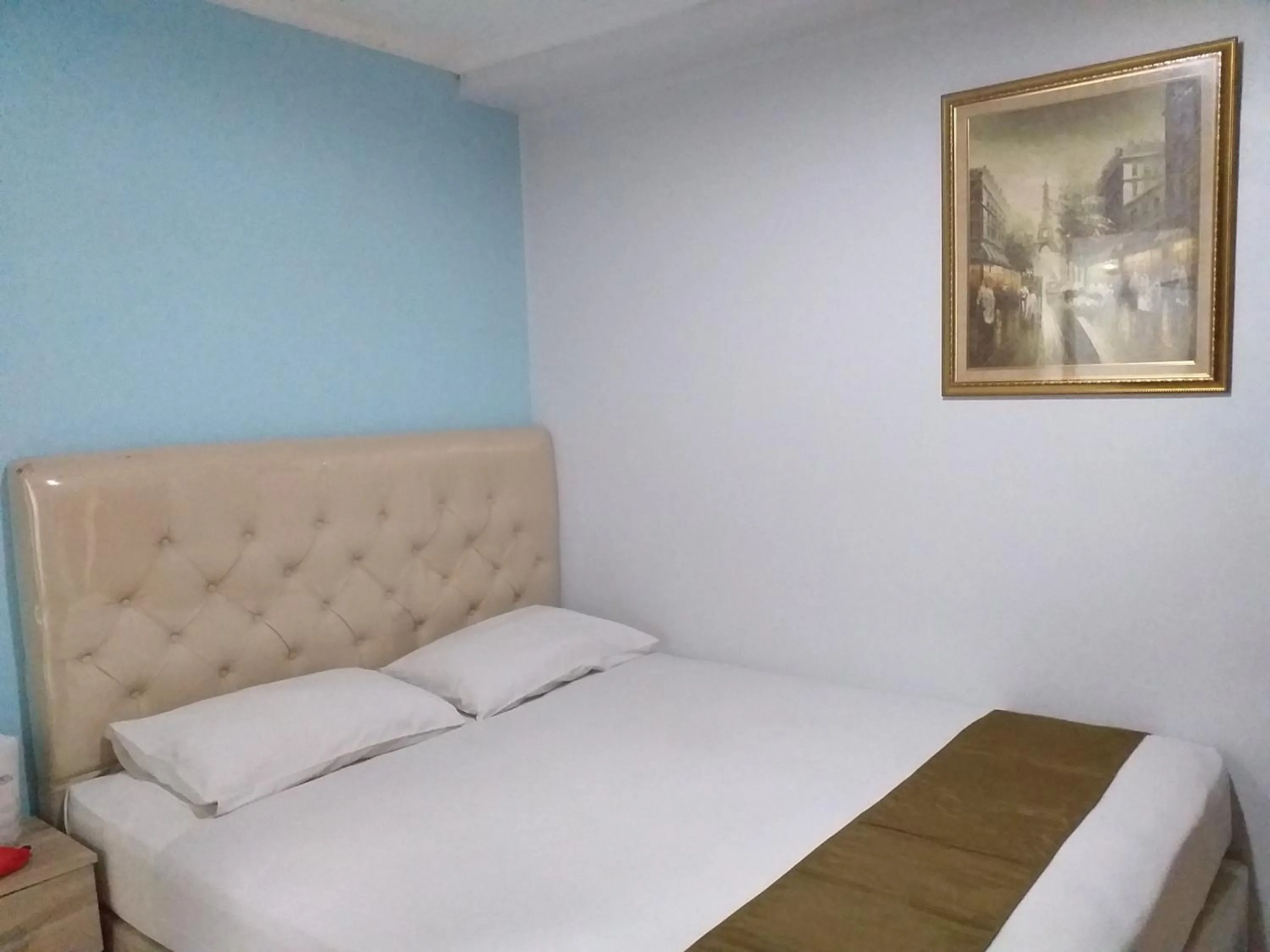 Bed in BLESSING RESIDENCE HOTEL