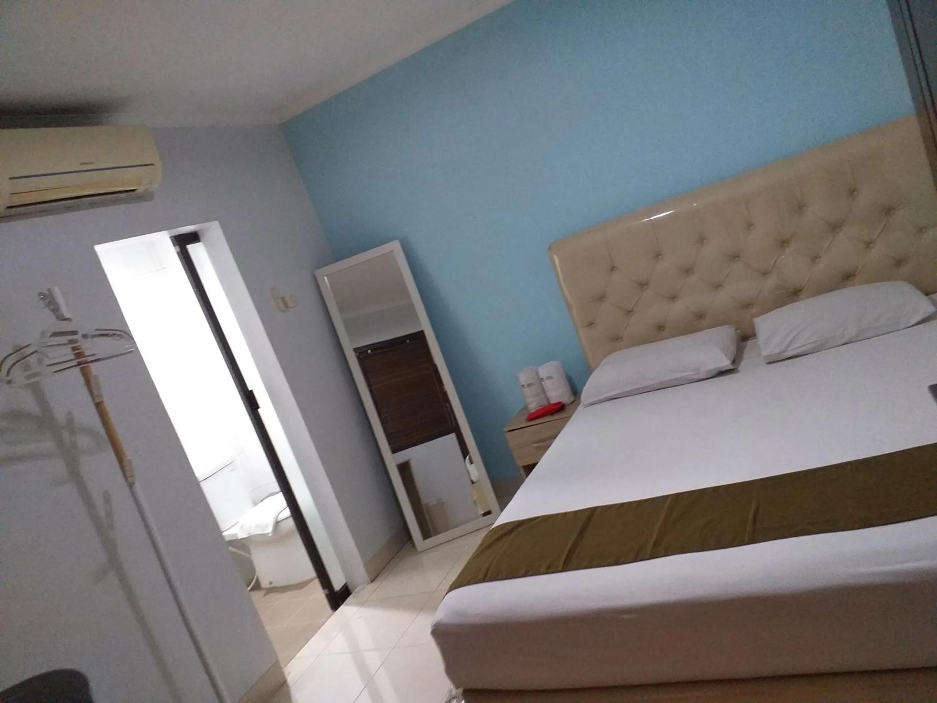 Bed in BLESSING RESIDENCE HOTEL