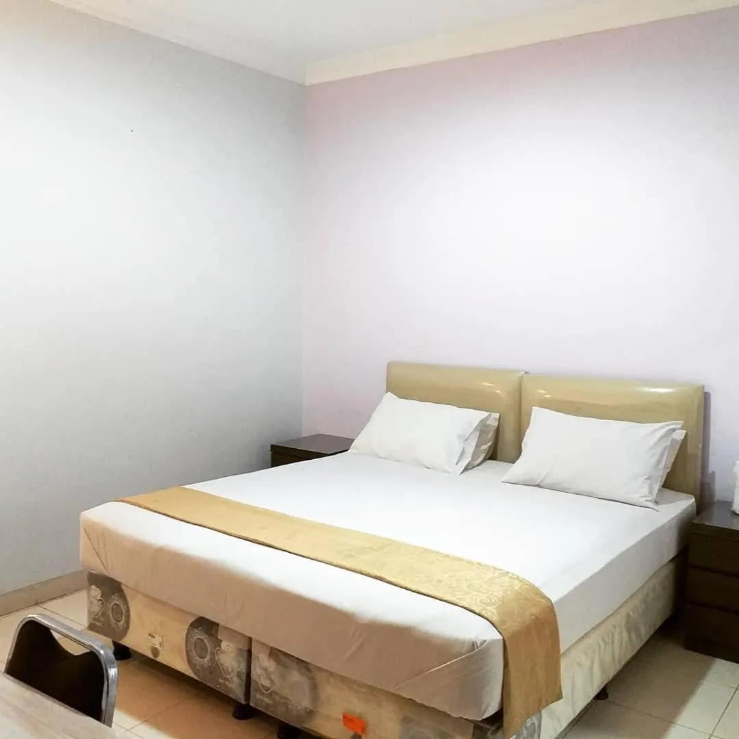 Bed in BLESSING RESIDENCE HOTEL