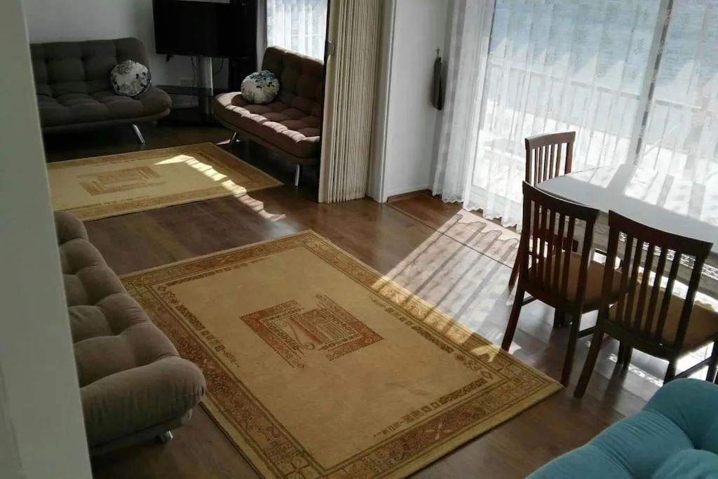 Communal lounge/ TV room in Uysal Suite and Loft Seaside