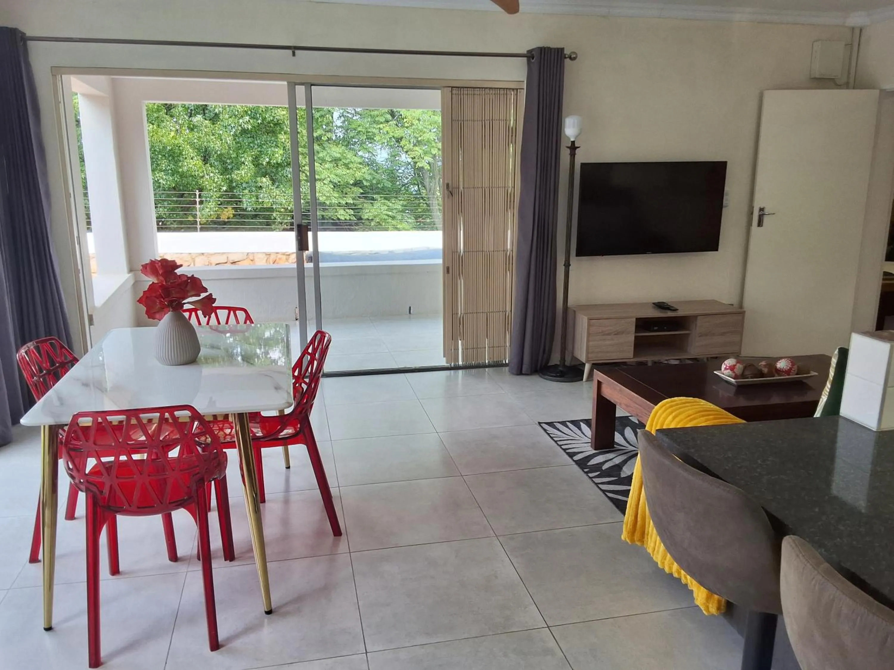 Dining area in CityView, a stunning modern apartment