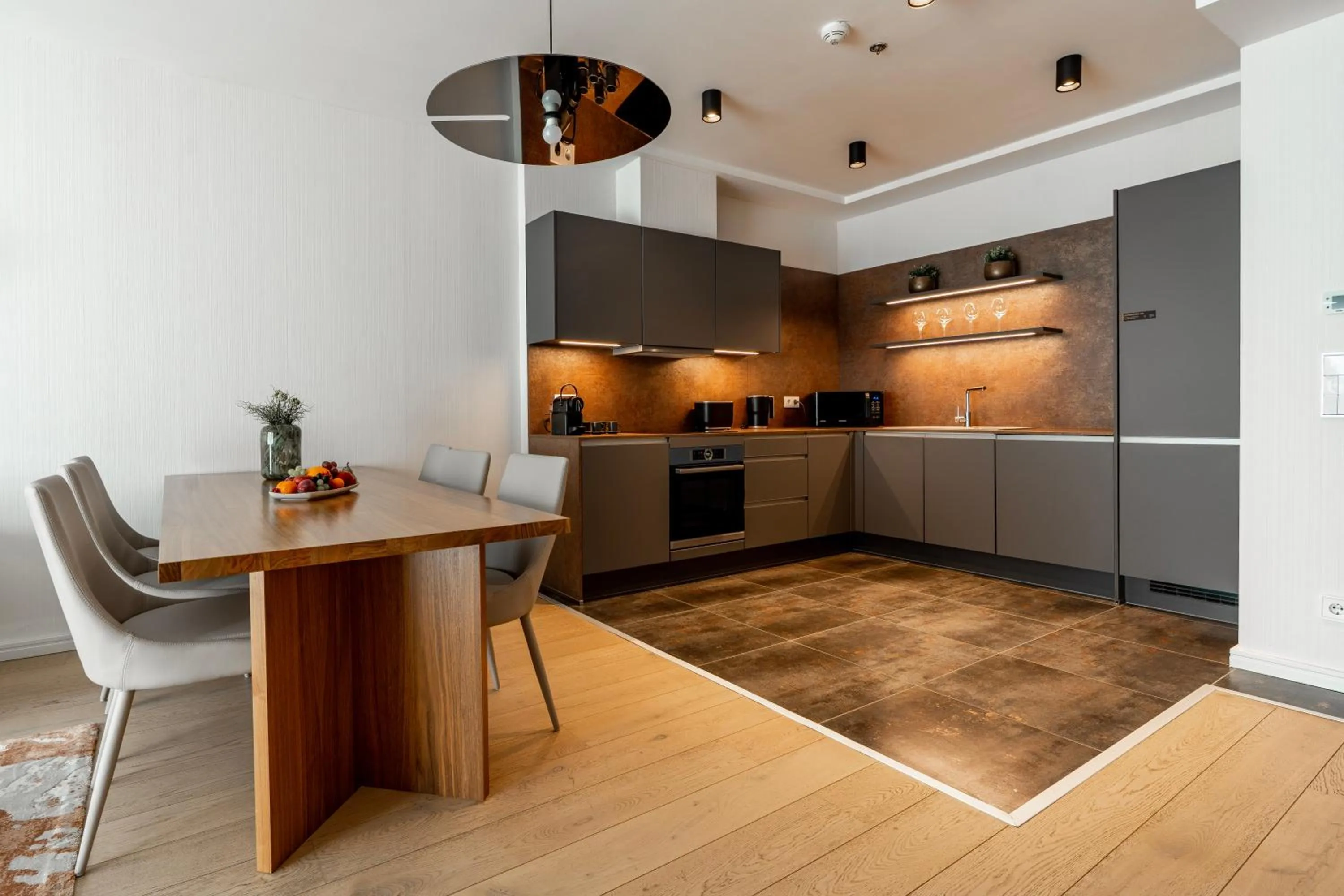 Kitchen or kitchenette in Emerald Downtown Luxury Suites by Continental Group