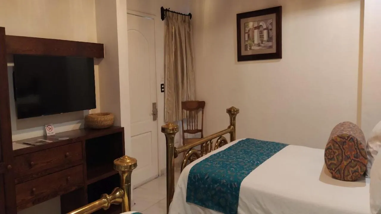 Bed in Posada de Maria Hotel Boutique & Spa