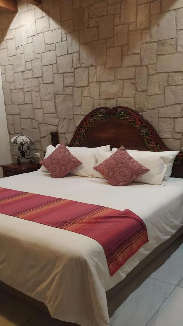Bed in Posada de Maria Hotel Boutique & Spa