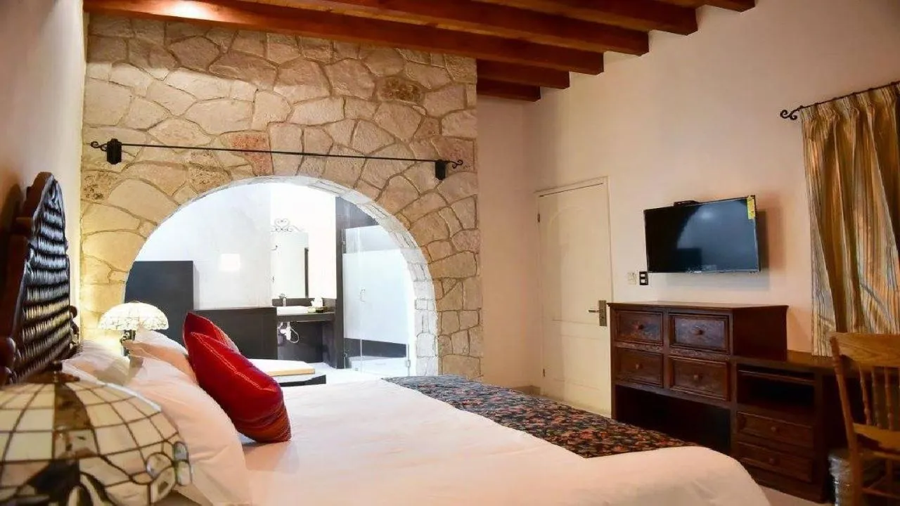 Bed in Posada de Maria Hotel Boutique & Spa