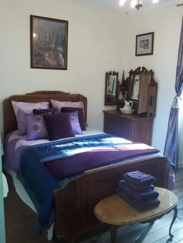 Bed in Sunset House Chambres de Hotes