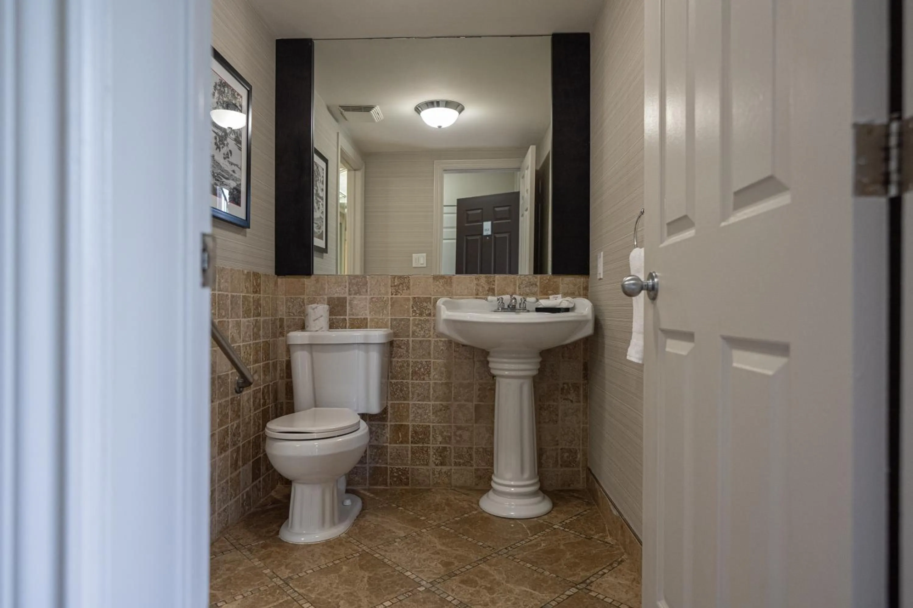 Toilet in Ramada by Wyndham Ottawa On The Rideau