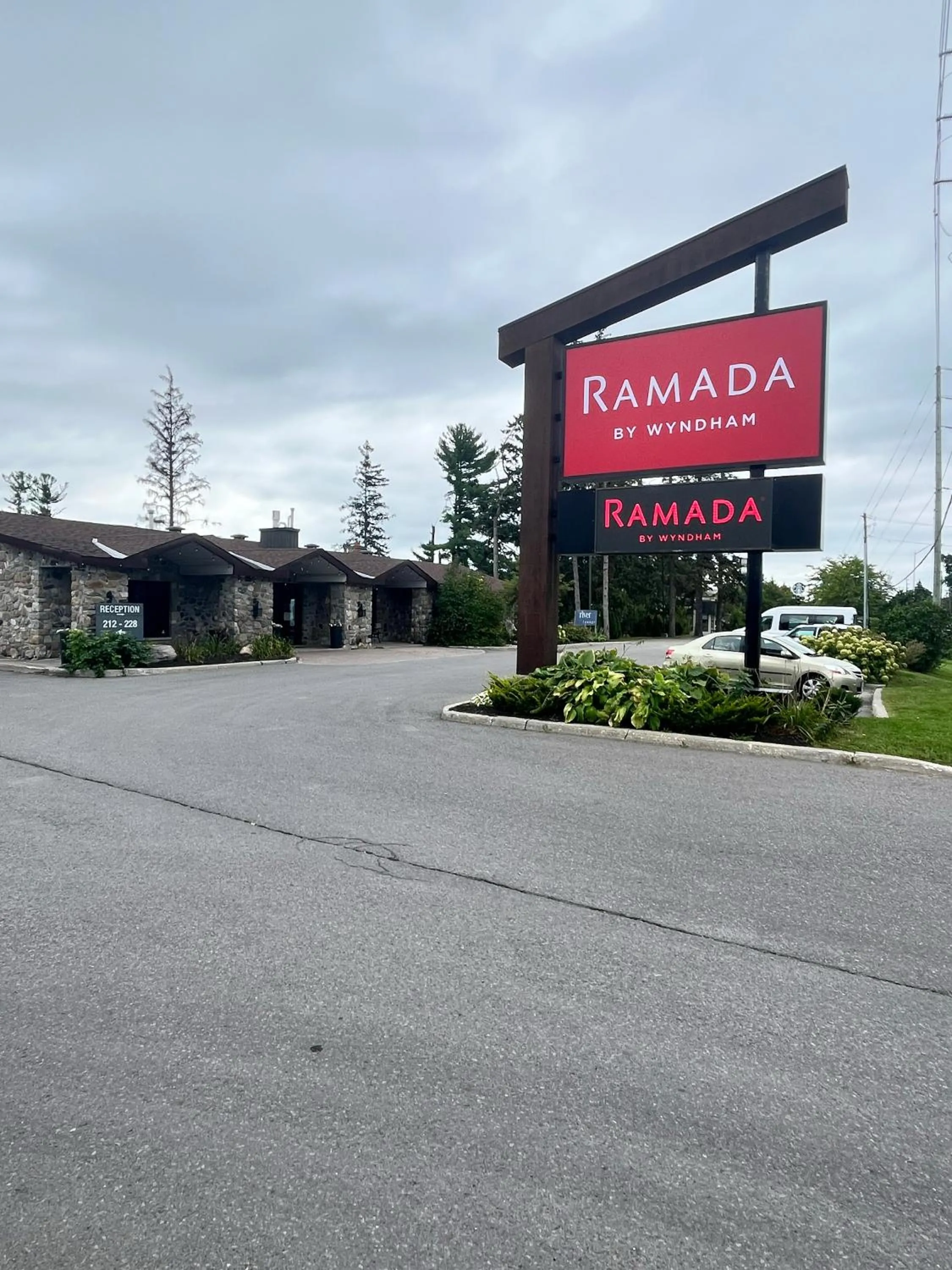 Property logo or sign in Ramada by Wyndham Ottawa On The Rideau