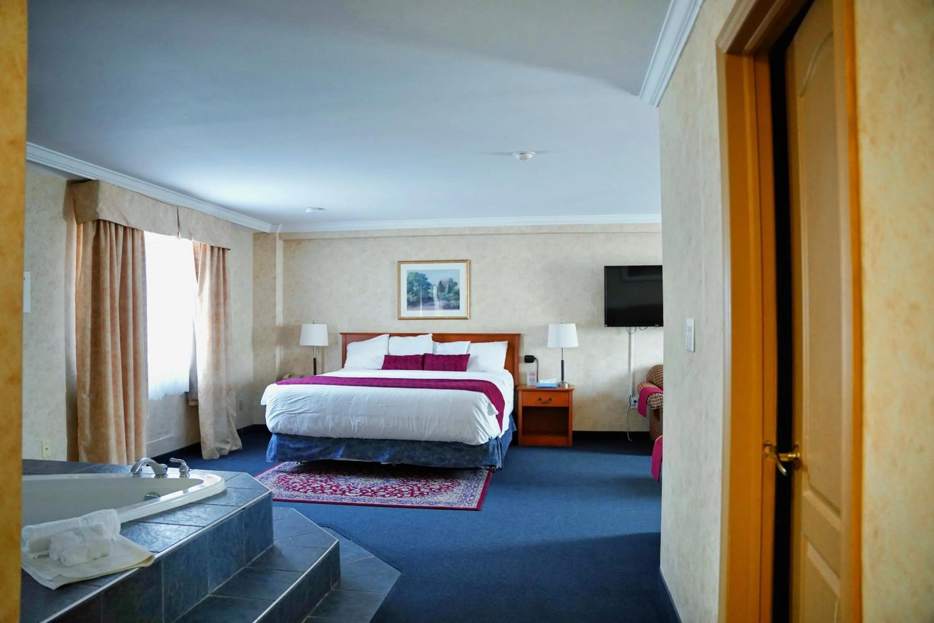 Bed in The Glengate Hotel & Suites