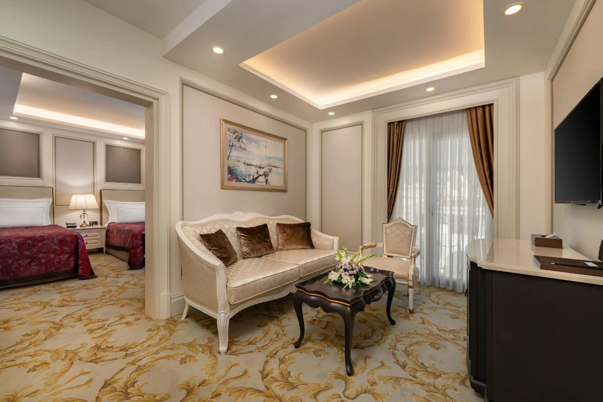 Seating area, Bed in Les Ambassadeurs Hotel Casino&Marina