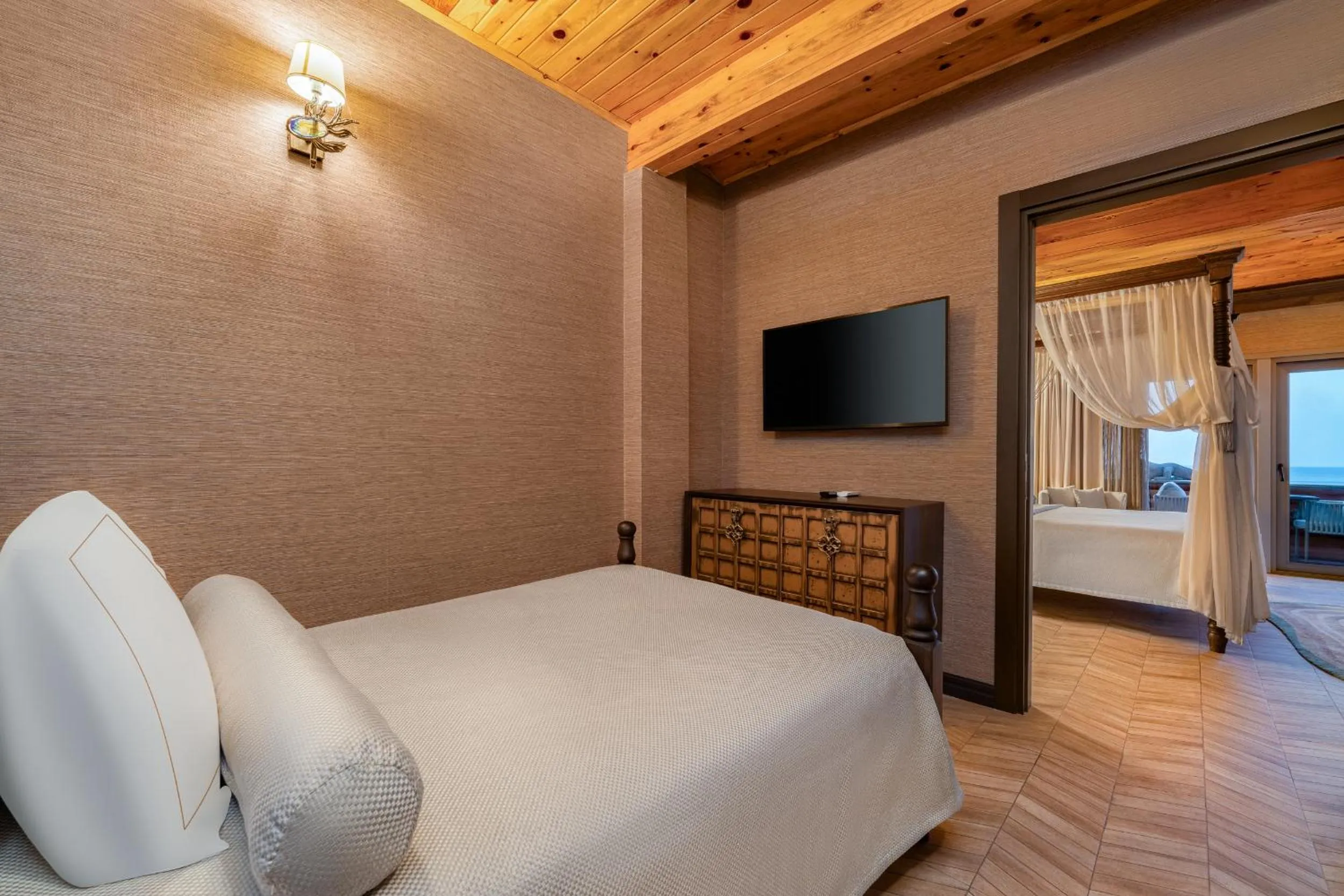 Seating area, Bed in Les Ambassadeurs Hotel Casino&Marina