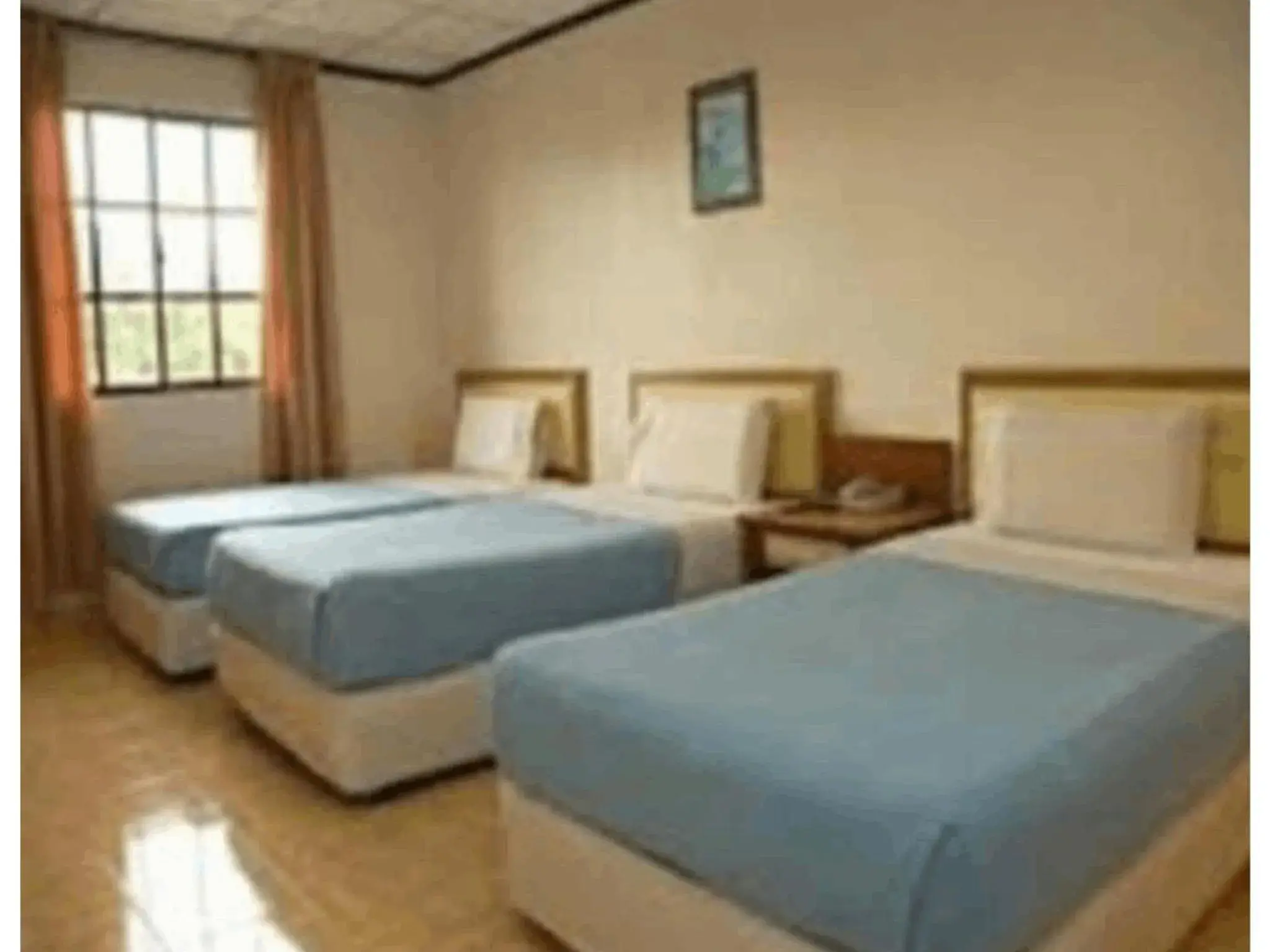 Triple Room in TS Hotel - Taman Rinting Triple Room in TS Hotel - Taman Rinting