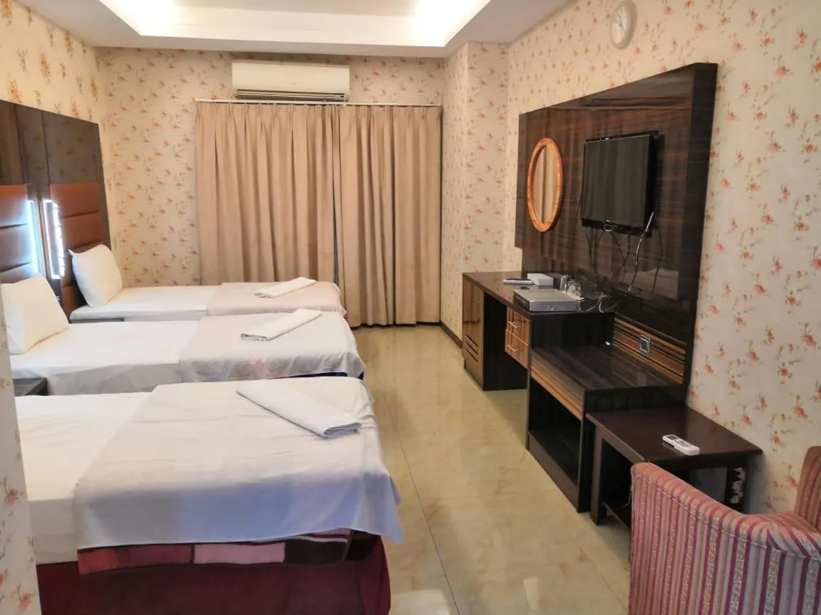 Bed in BURJ NAHAR HOTEL L.L.C