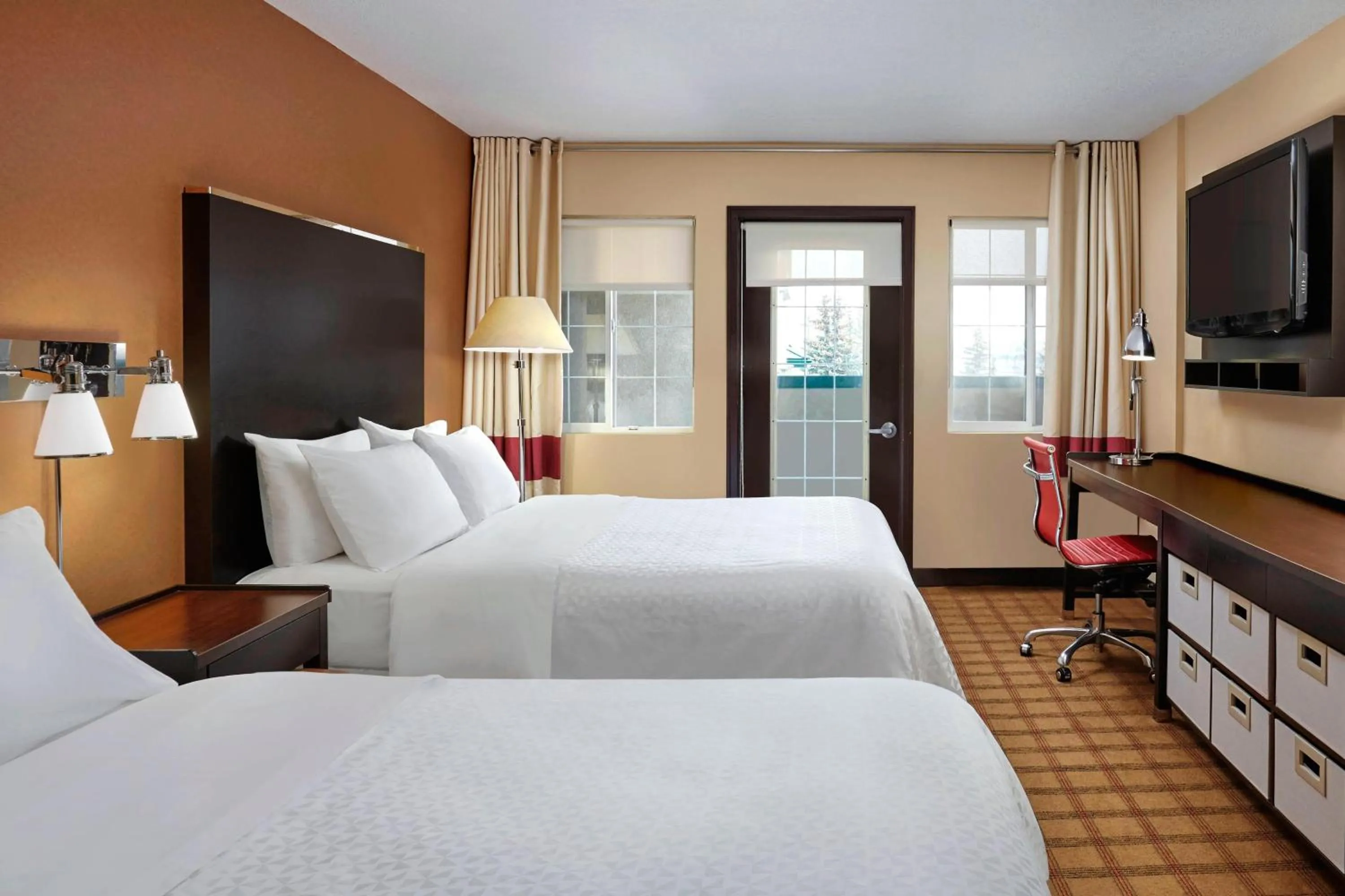 Photo of the whole room, Bed in Four Points by Sheraton Hotel & Suites Calgary West