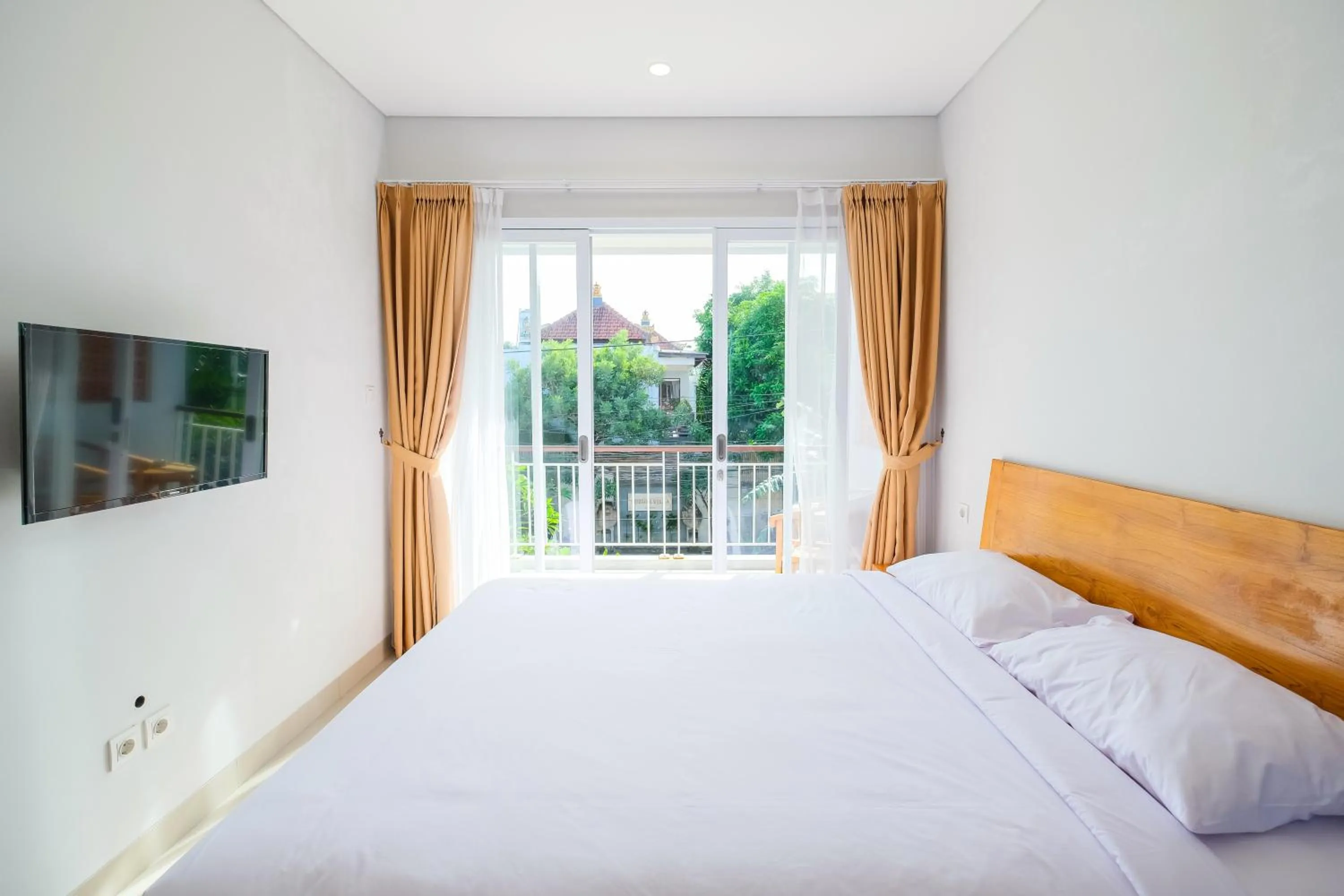 Bedroom, Bed in Dharma Guest House Seminyak RedPartner