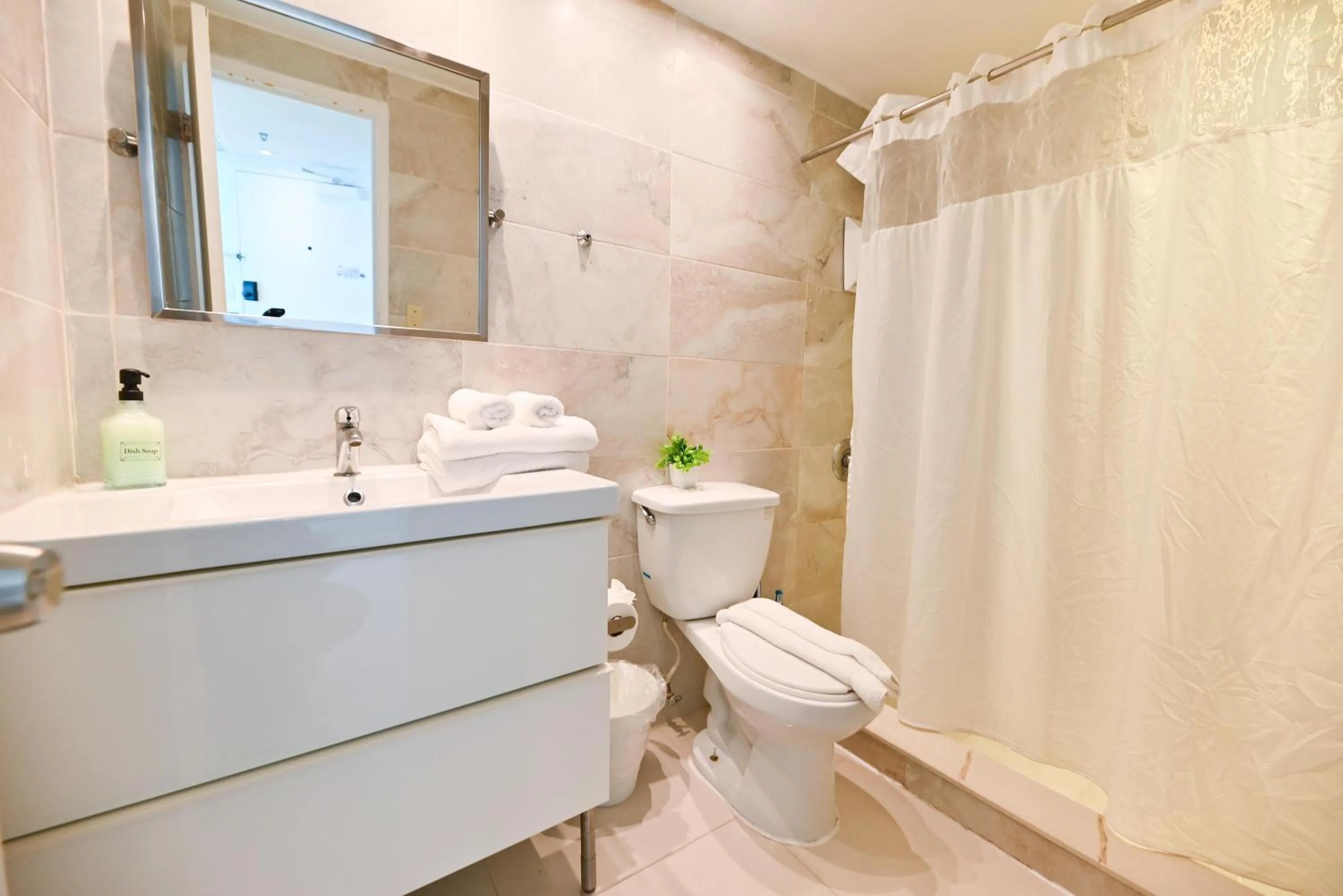 Shower in SeaStays Apartments