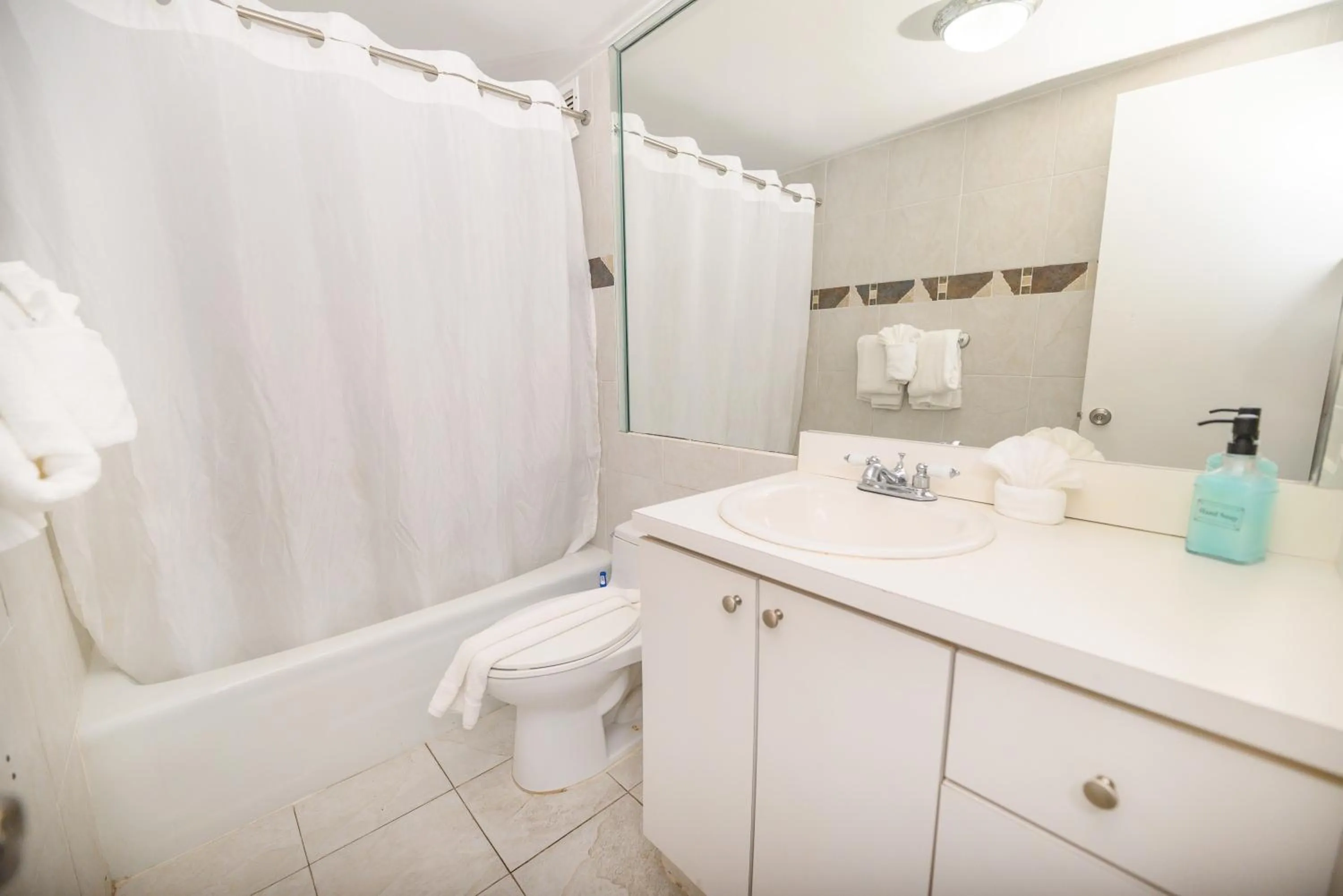 Shower in SeaStays Apartments