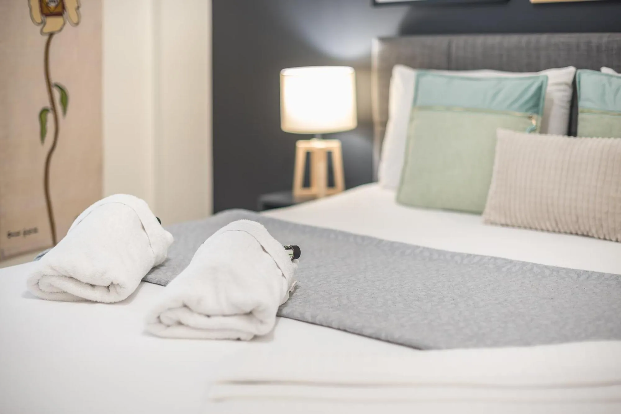 Bed in Elegant Suite by CloudKeys