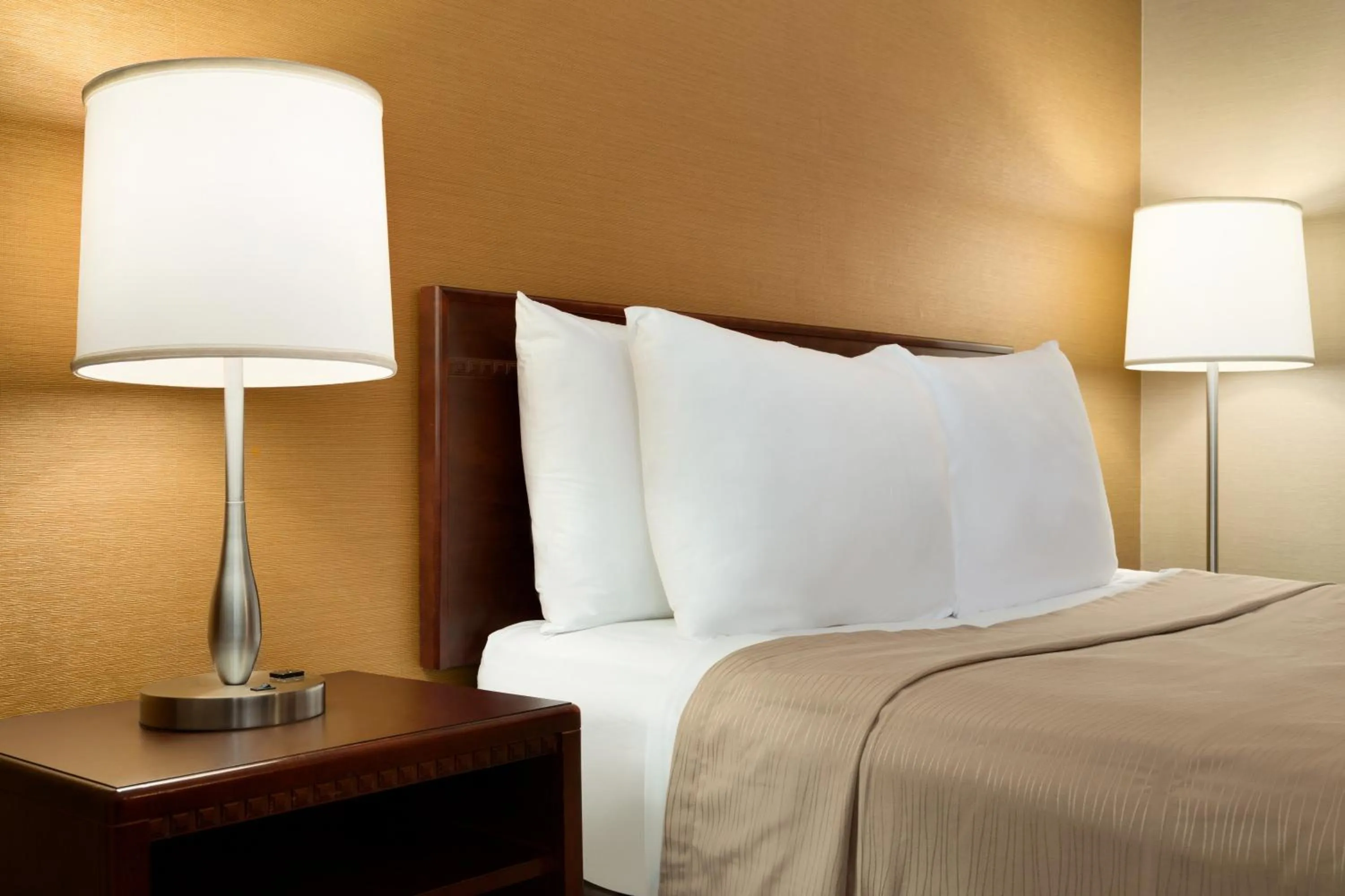 Bedroom, Seating Area in Travelodge by Wyndham Toronto East