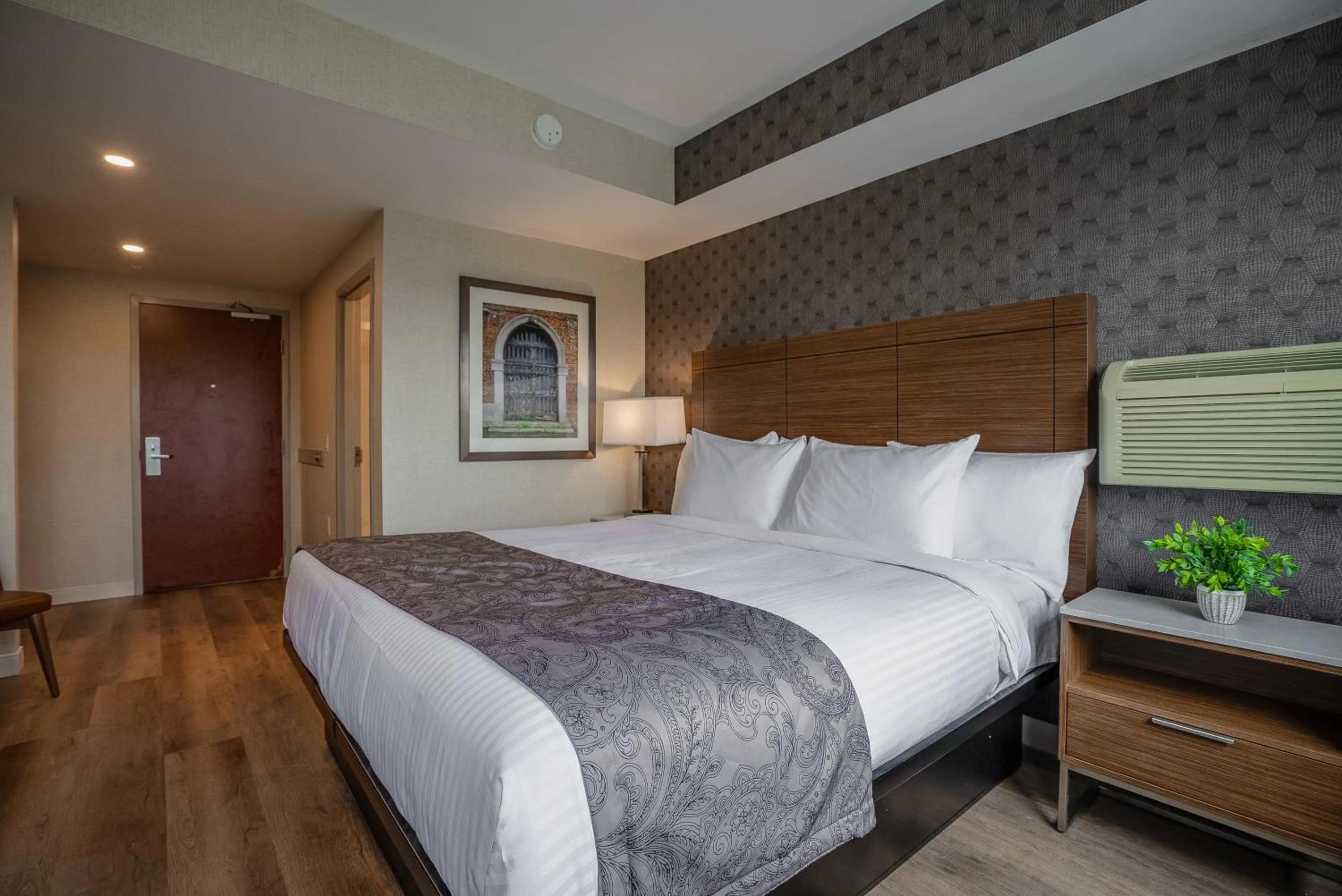 Bed in Monte Carlo Inn Oakville Suites