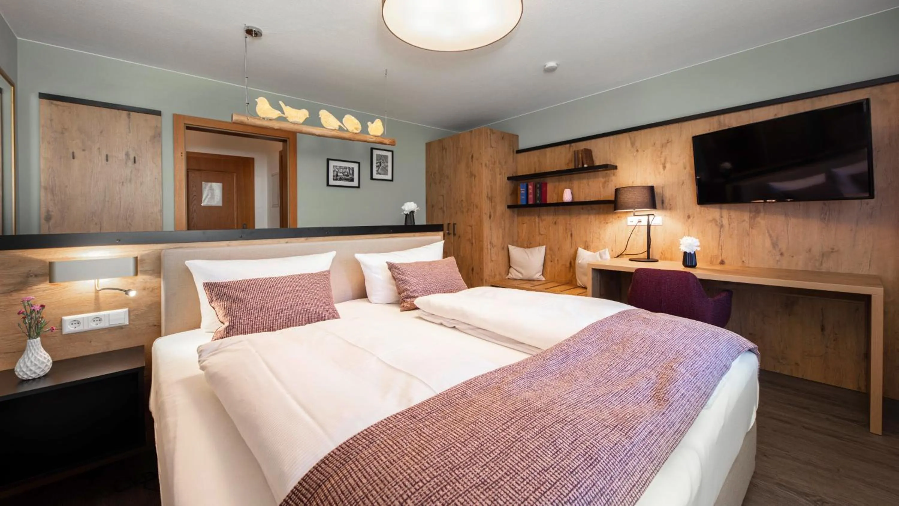 Bed in Aparthotel Chiemgaufuchs - CHIEMGAUKARTE