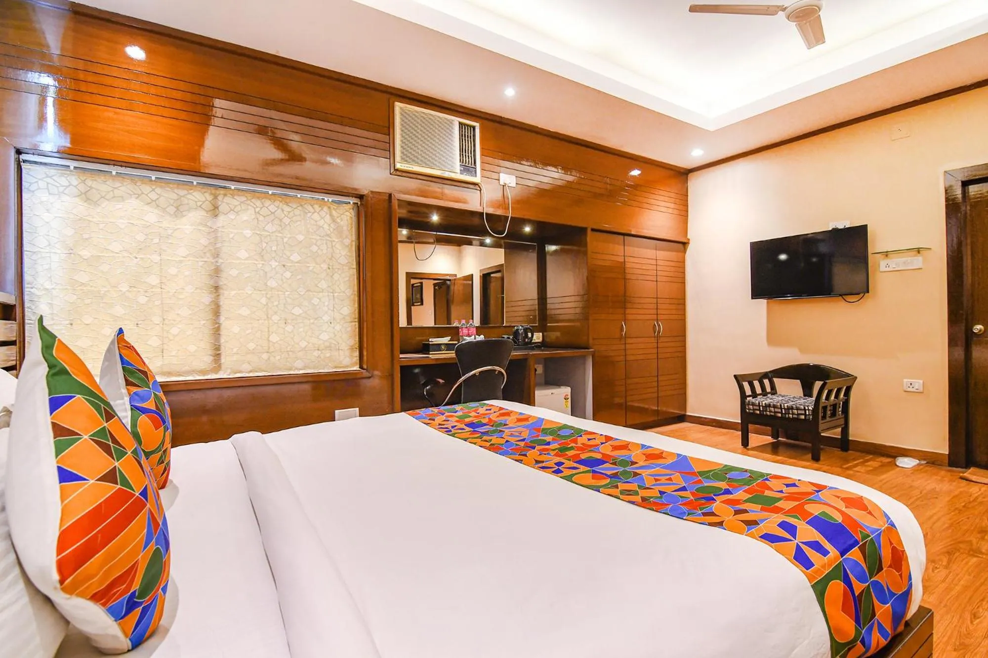 Bed in FabHotel Shivani International