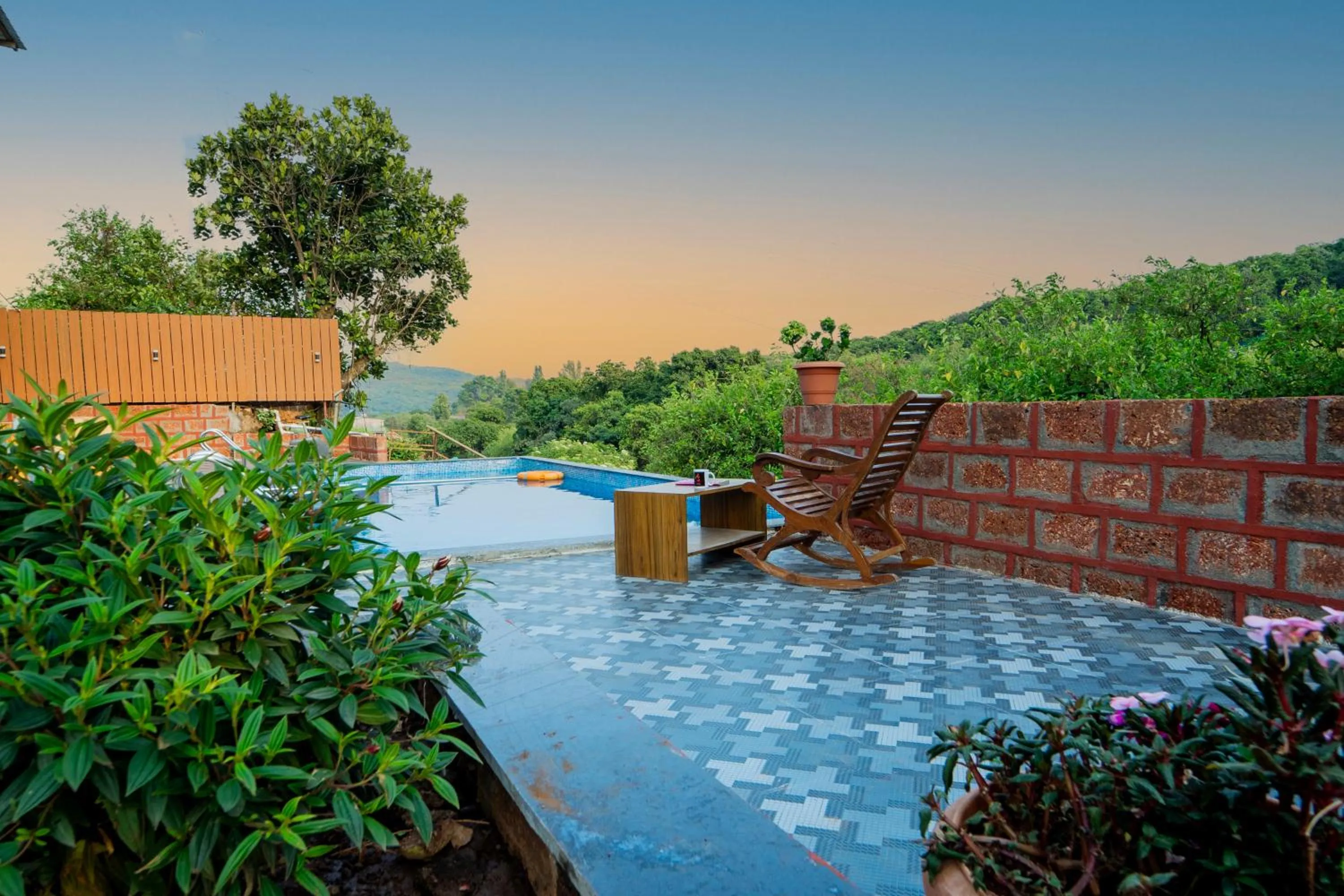 Swimming pool in Treebo La Paradise