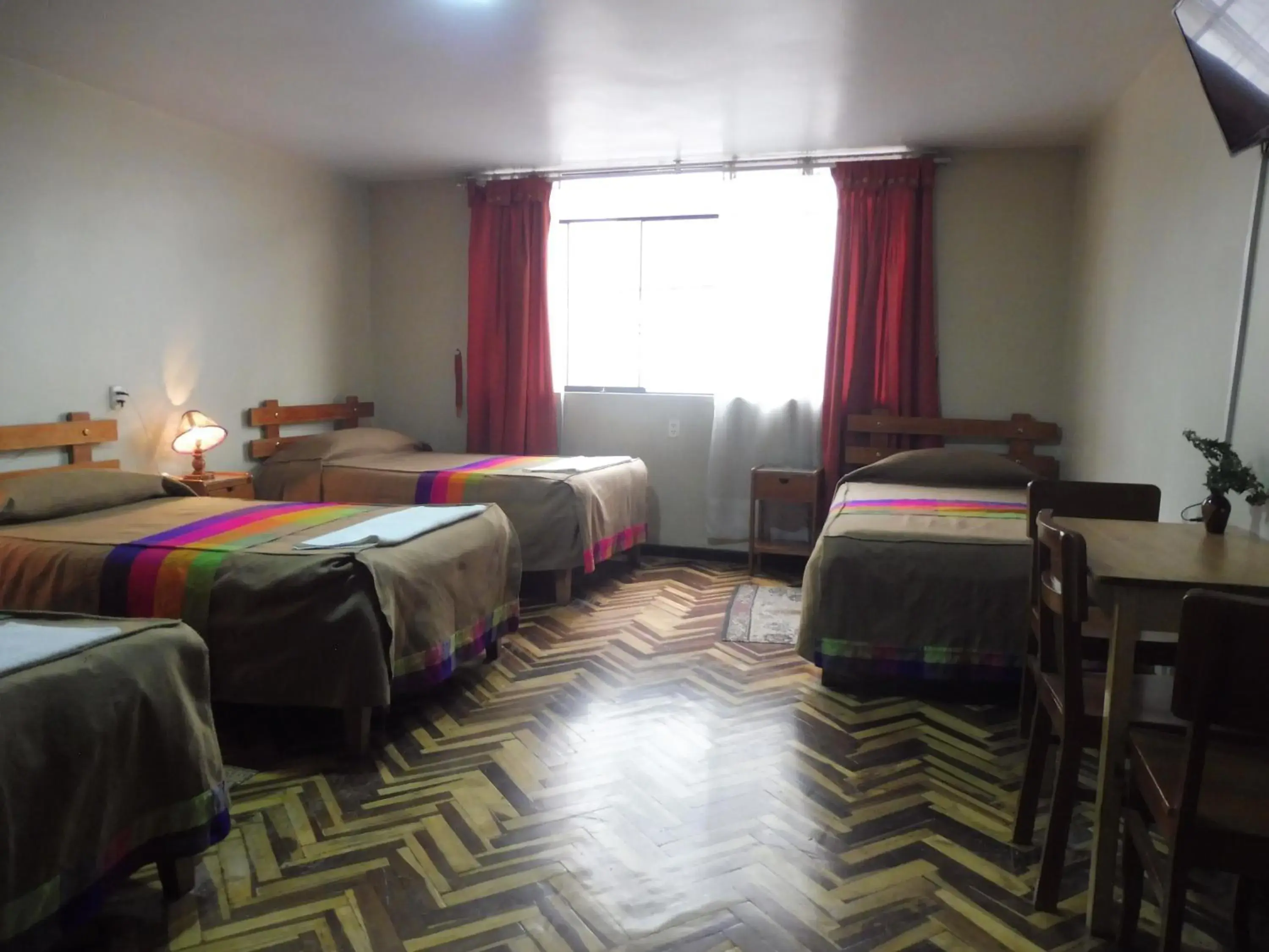 Classic Quadruple Room in Hostal los Uros Classic Quadruple Room in Hostal los Uros