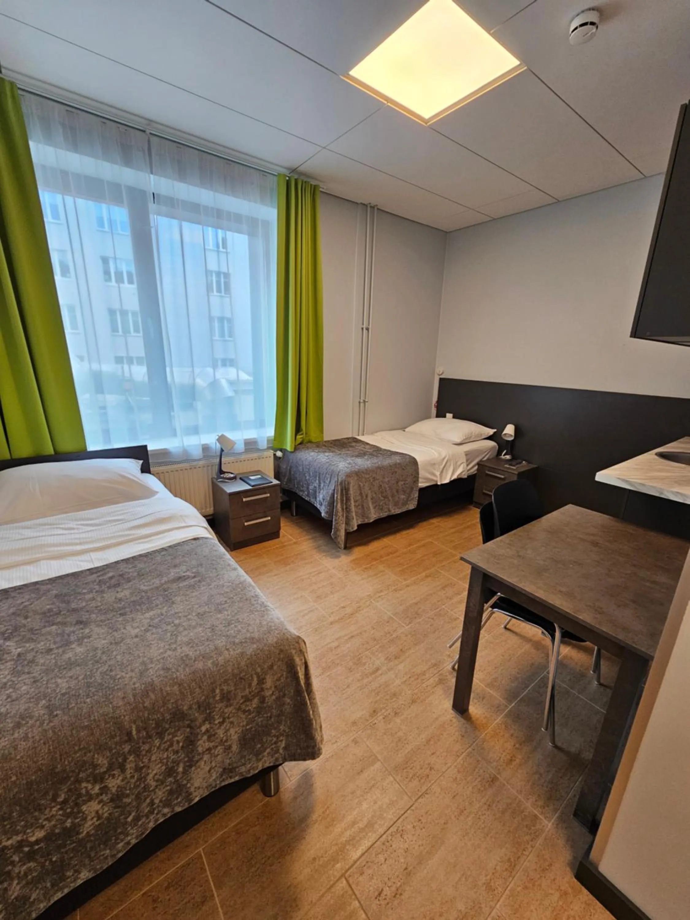 Bed in City Yard Inn Hotel