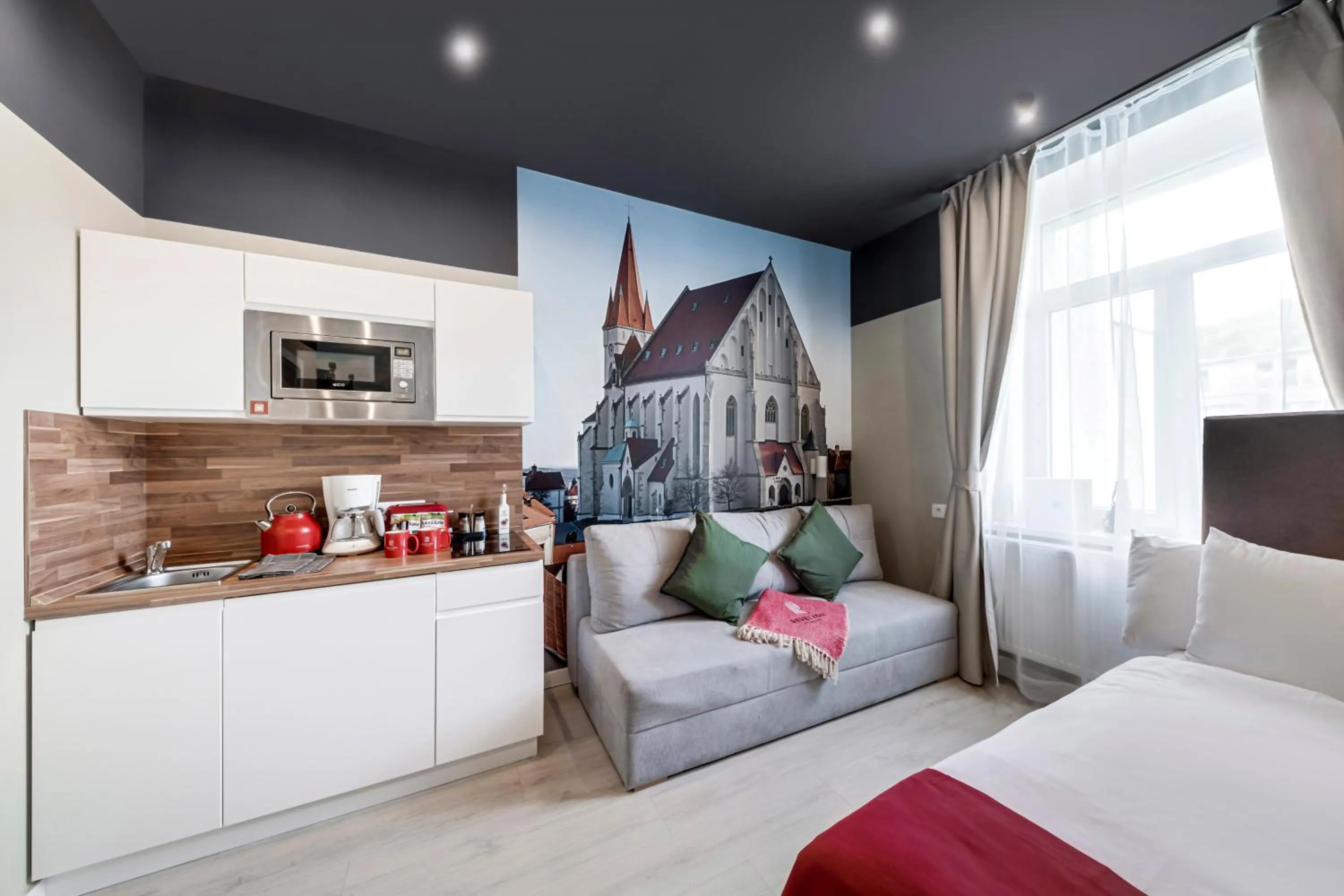 Seating area, Bed in Revelton Studios Prague